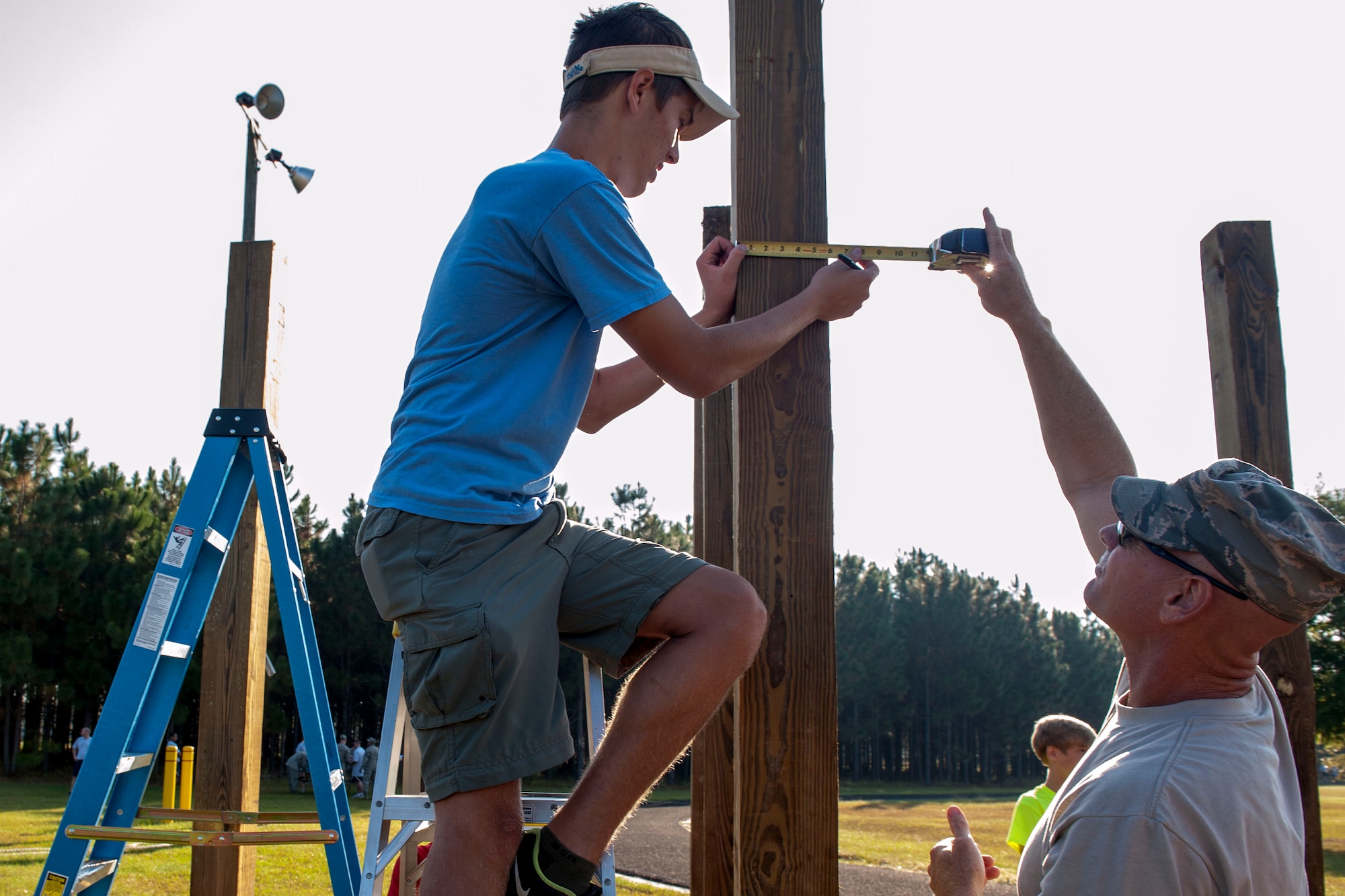 Boy Scouts with Troop 95 from Irmo, S.C., build pull-up bars at McEntire Joint National Guard Base, S.C., as part of their Eagle Scout project with help of the 169th Civil Engineer Squadron, Oct. 5, 2013.  The project is a leadership task and final step before earning Eagle Scout. (U.S. Air National Guard photo by Staff Sgt. Jorge Intriago/Released) 