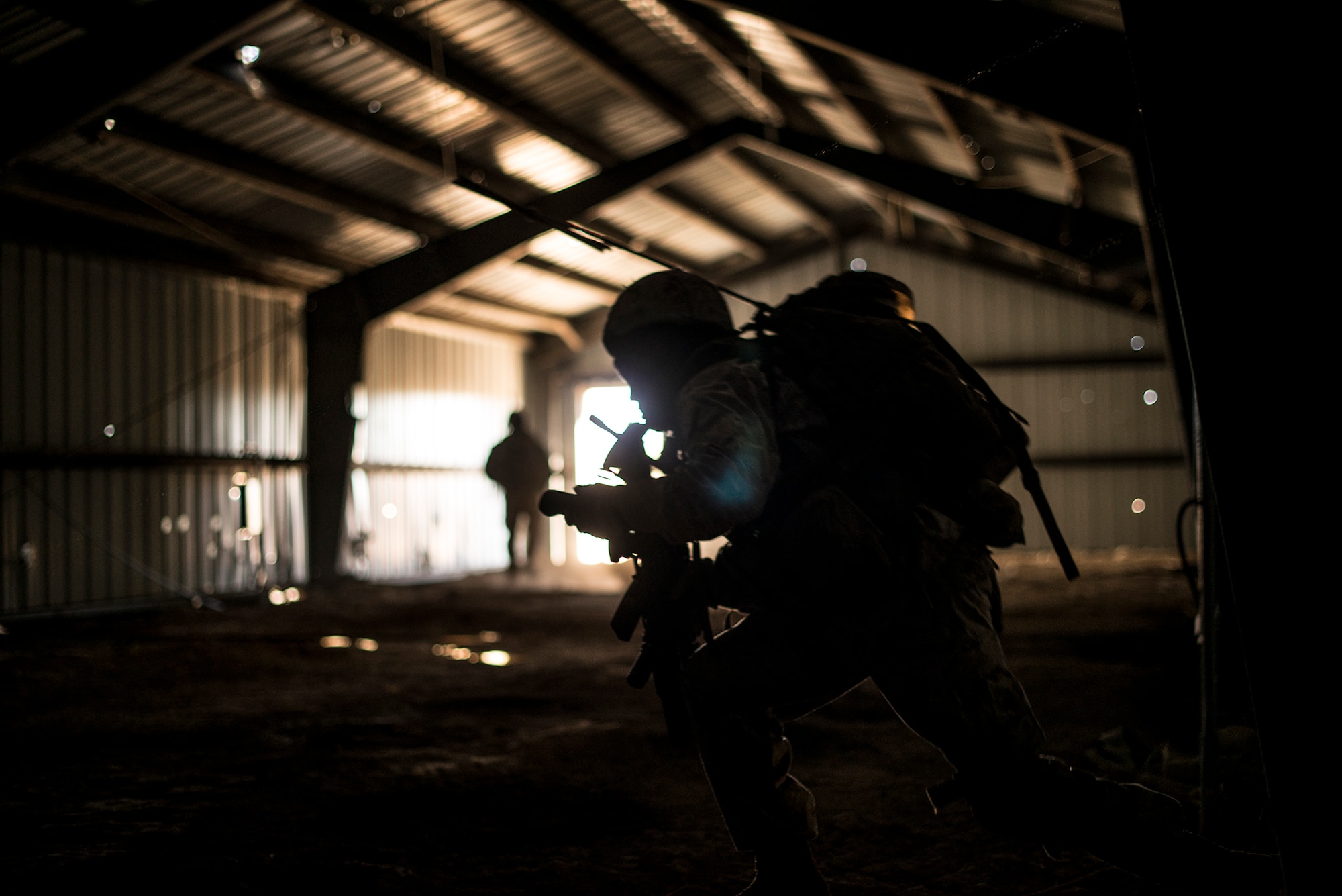 U.S. Marine Cpl. Daniel Soto, 1st Air Naval Gunfire Liaison Company forward air controller deployed from Camp Pendleton, Calif., calls his four-man team to exit a cleared building during exercise Mountain Roundup 2013 at Juniper Butte Range, about 70 miles from Mountain Home Air Force Base, Idaho, Oct. 8, 2013. JTACs can change the course of any firefight or any enemy worldwide in a defensive posture by deterring the enemy from firing on friendly forces, or can go kinetic and make sure those insurgents will never fire on a friendly soldier again.  (U.S. Air Force photo by Master Sgt. Kevin Wallace/RELEASED)