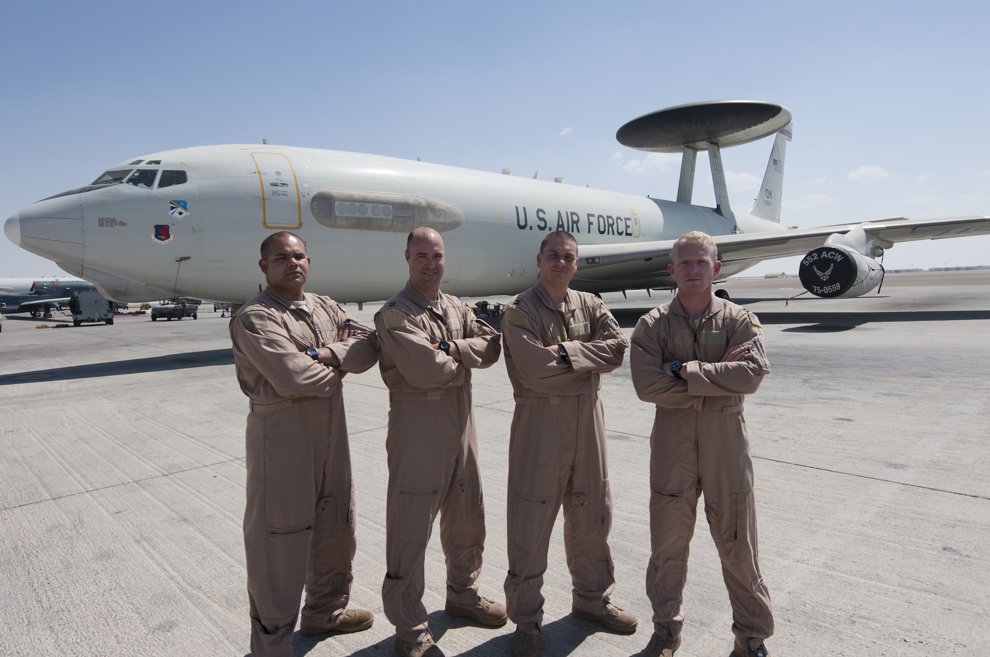 A U.S. Air Force E-3 Sentry airborne warning and control system crew stands infront of their aircraft at an undisclosed location in Southwest Asia Sept. 23, 2013. The crew won the Aircrew Award of Distinction awarded by Air Forces Central Command Safety Office for displaying skill and ingenuity in handling an exceptionally difficult and unusual situation in the aircraft. (U.S. Air Force photo by Staff Sgt. Jacob Morgan)