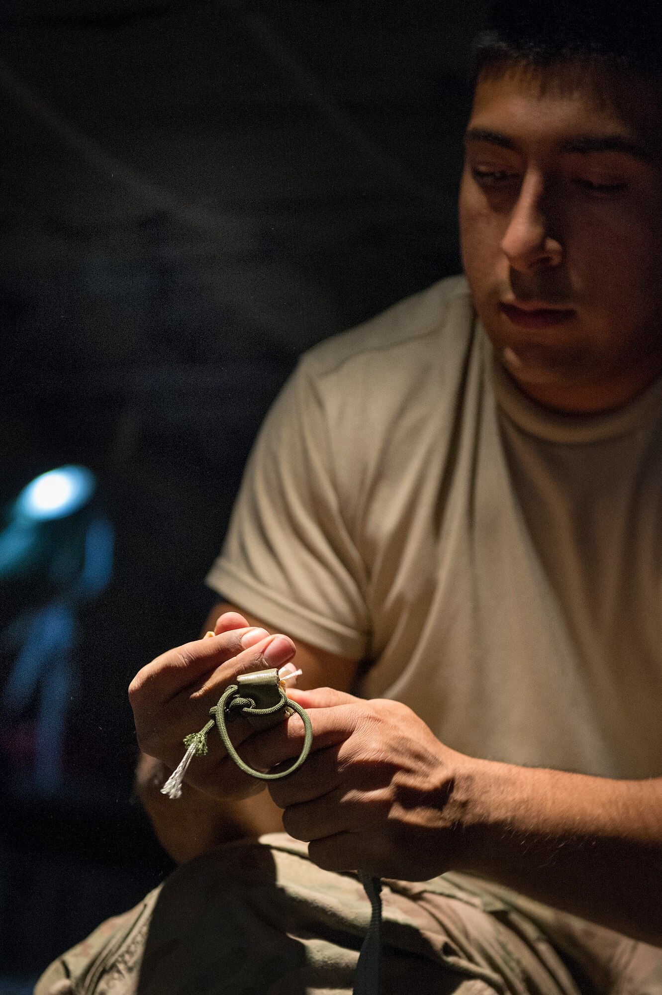 Spc. Philip Martinez, Combined Joint Special Operations Task Force-Afghanistan parachute rigger, prepares a cargo bundle for an airdrop aboard a C-130H Hercules at Bagram Air Field, Parwan province, Afghanistan, Oct. 6, 2013. Aircrew from the 774th Expeditionary Airlift Squadron delivered 32 cargo bundles during two trips to remote drop zones in Ghazni province. Martinez hails from Genoa, Ohio. (USAF Photo/Master Sgt. Ben Bloker)