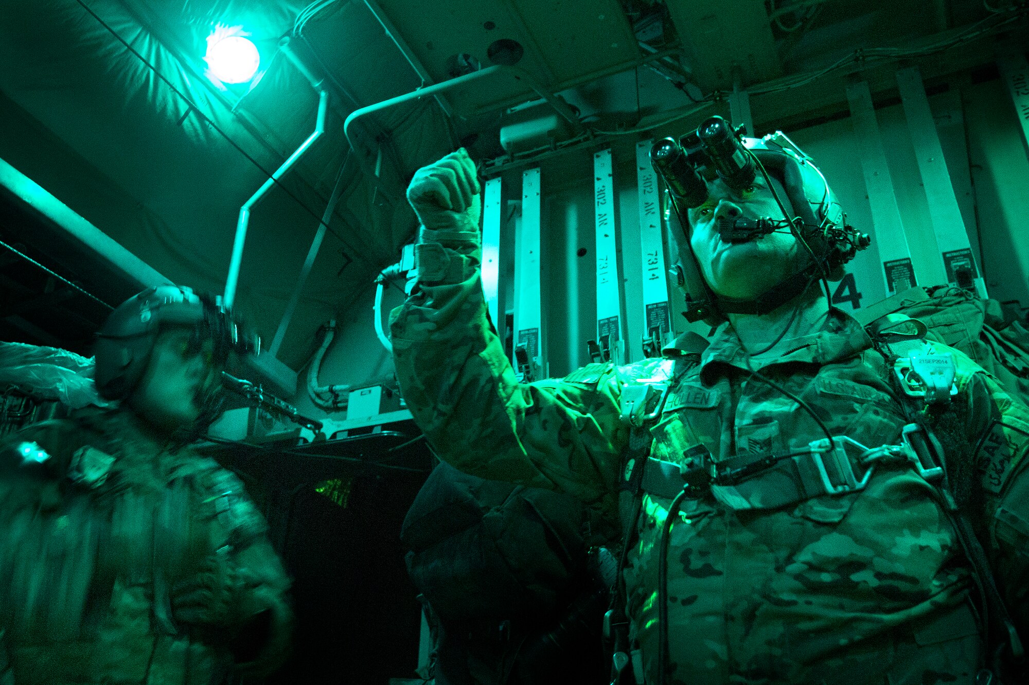 Tech Sgt. Richard Mulhollen, 774th Expeditionary Airlift Squadron C-130H Hercules loadmaster, signals "all ready" for a cargo airdrop in remote Ghazni province, Afghanistan, Oct. 7, 2013. Mulhollen, a Gardnerville, Nev., native, is assisted by Senior Airman Larry Webster, a Lyons, Colo., native. Both Mulhollen and Webster are deployed from Little Rock Air Force Base, Ark. (USAF Photo/Master Sgt. Ben Bloker)