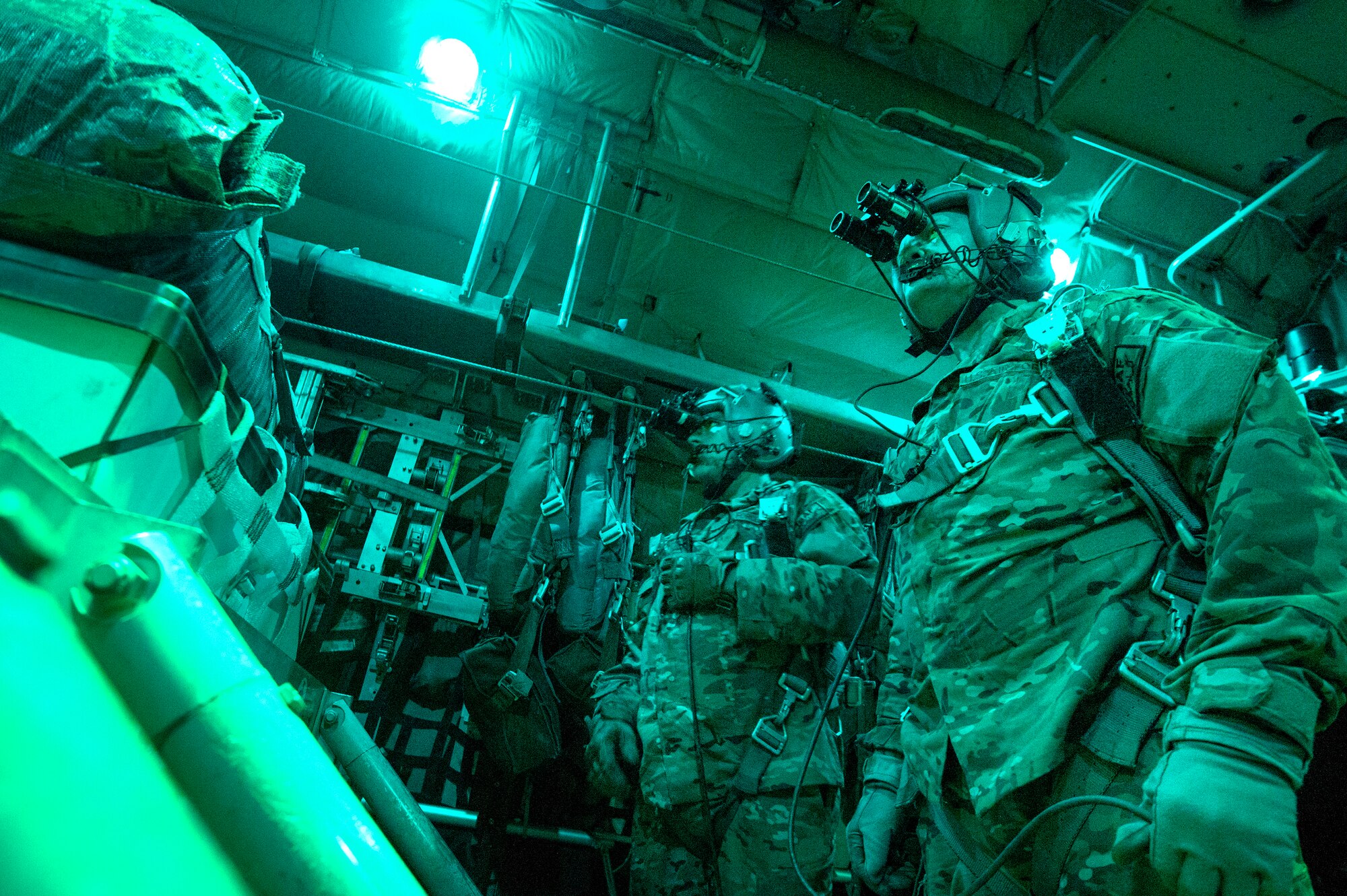 Senior Airman Larry Webster and Tech Sgt. Richard Mulhollen, 774th Expeditionary Airlift Squadron C-130H Hercules loadmasters, wait for the go-ahead to release cargo over a remote drop zone in Ghazni province, Afghanistan, Oct. 7, 2013. Webster, a Lyons, Colo., native, and Mulhollen, a Gardnerville, Nev., native, are deployed from Little Rock Air Force Base, Ark. (USAF Photo/Master Sgt. Ben Bloker)