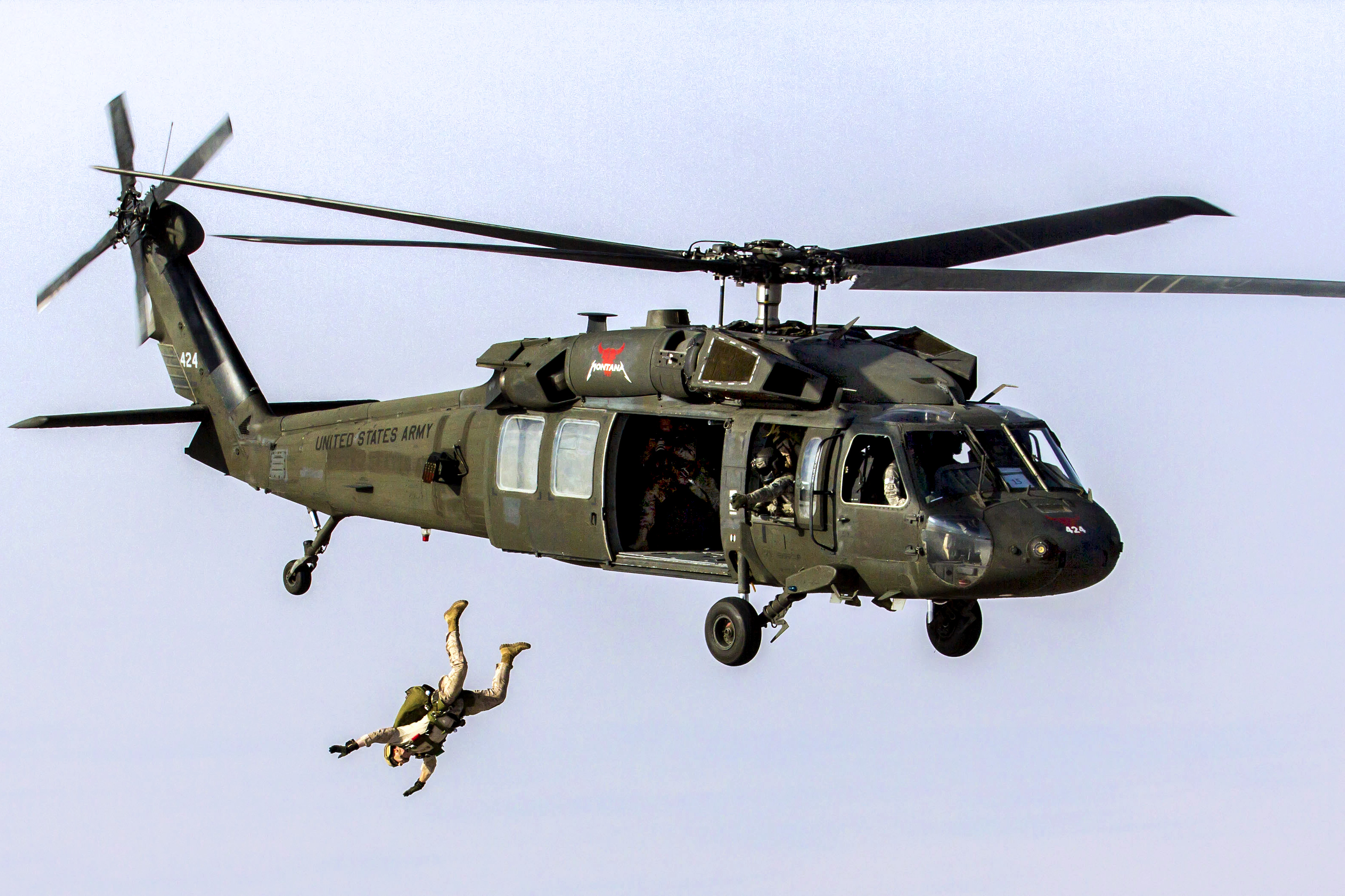 U.S. Marines conduct military free-fall parachute operations from a UH-60  Black Hawk helicopter in