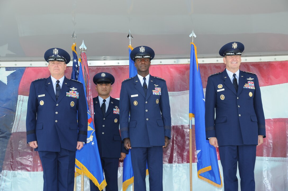 JOINT BASE SAN ANTONIO-RANDOLPH, Texas -- (From left to right) Air Force Chief of Staff Gen. Mark A. Welsh III, Chief Master Sgt. Gerardo Tapia, Air Education and Training Command command chief, Gen. Edward A. Rice Jr., AETC commander, and Gen. Robin Rand, future AETC commander, stand at attention for the advancement of the Color Guard during the AETC change of command ceremony here Oct. 10. (U.S. Air Force photo by Rich McFadden)
