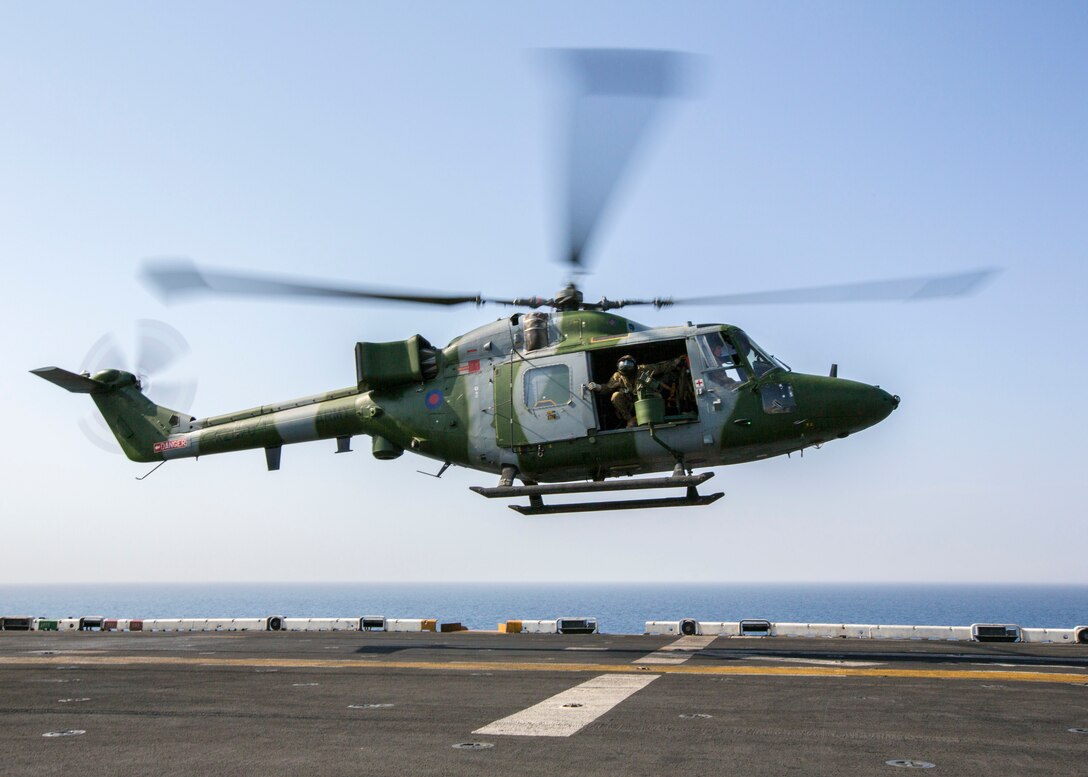 A Westland Lynx battlefield helicopter assigned to United Kingdom’s Army Air Corps lands on the flight deck of the USS Kearsarge (LHD 3) while conducting landing qualifications, at sea, Sept. 15, 2013. The 26th MEU is a Marine Air-Ground Task Force forward-deployed to the U.S. 5th and 6th Fleet areas of responsibility aboard the Kearsarge Amphibious Ready Group serving as a sea-based, expeditionary crisis response force capable of conducting amphibious operations across the full range of military operations. (U.S. Marine Corps photo by Sgt. Christopher Q. Stone, 26th MEU Combat Camera/Released)