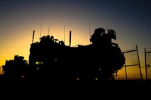 A Logistics Vehicle System Replacement carrying vehicles destined for Camp Leatherneck, Afghanistan, sits in the motor pool for Combat Logistics Regiment 2, Regional Command (Southwest), at Camp Dwyer, Helmand province, Afghanistan, Sept. 30, 2013. A convoy of more than 40 vehicles set out from Camp Dwyer the following morning during a multi-day combat logistics patrol through the province.