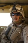 Sgt. Victor Reynoso, a Brooklyn, N.Y., native and vehicle commander with Combat Logistics Regiment 2, Regional Command (Southwest), poses for a photo inside his Mine Resistant, Ambush Protected vehicle during a combat logistics patrol in Helmand province, Afghanistan, Oct. 1, 2013. Reynoso, a Marine reservist, also serves as a New York City police officer.