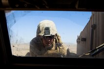 Lance Cpl. Justin Miller, a Farmingville, N.Y., native and vehicle operator with Combat Logistics Regiment 2, Regional Command (Southwest), attempts to repair the engine of his Mine Resistant, Ambush Protected vehicle during a convoy through Helmand province, Afghanistan, Oct. 2, 2013. Miller managed to fix his vehicle in the field before retaking his place at the rear of a 40-vehicle convoy.