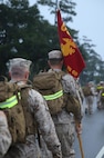A Marine with Transportation and Support Company, Combat Logistics Battalion 2, 2nd Marine Logistics Group carries the guidon for TS Co. during a battalion conditioning hike aboard Camp Lejeune, N.C., Oct. 10, 2013. The guidon was used as a standard for the company to follow and to differentiate the units to passersby. 