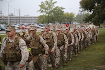Marines and sailors with Combat Logistics Battalion 2, Combat Logistics Regiment 2, 2nd Marine Logistics Group march to the end of a battalion hike aboard Camp Lejeune, N.C., Oct. 10, 2013. The battalion completed the approximately 3.8-mile, hour-long conditioning hike in the rain alongside Combat Logistics Regiment 25’s regimental run.