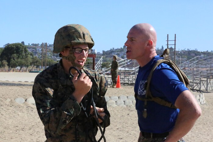 Gunnery Sgt. Jason L. Buckingham, drill instructor, Platoon 3229, Company K, 3rd Recruit Training Battalion, corrects a recruit for forgetting to properly greet and respond to drill instructors during the Rappel Tower aboard the depot, Sept. 27. Buckingham was meritoriously promoted to staff sergeant for his efforts during his recruiting tour.