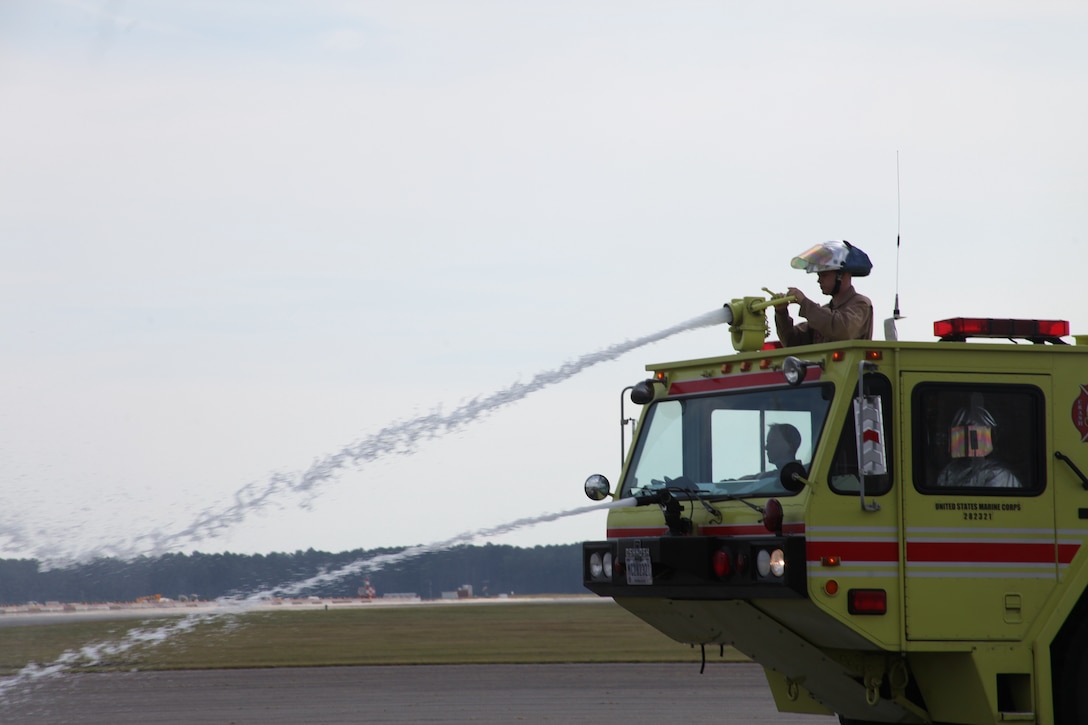 Aircraft Rescue and Firefighting Marines participate in shipboard aircraft firefighting training on the flightline Oct. 3 to prepare for future deployments at sea. A four-man crew, including a driver, rescue man, turret operator and a landline operator, man the P-19 Firefighting Vehicle. During the training the Marines worked on firefighter dispatch skills, rescue strategies and the use of appropriate rescue procedures.


