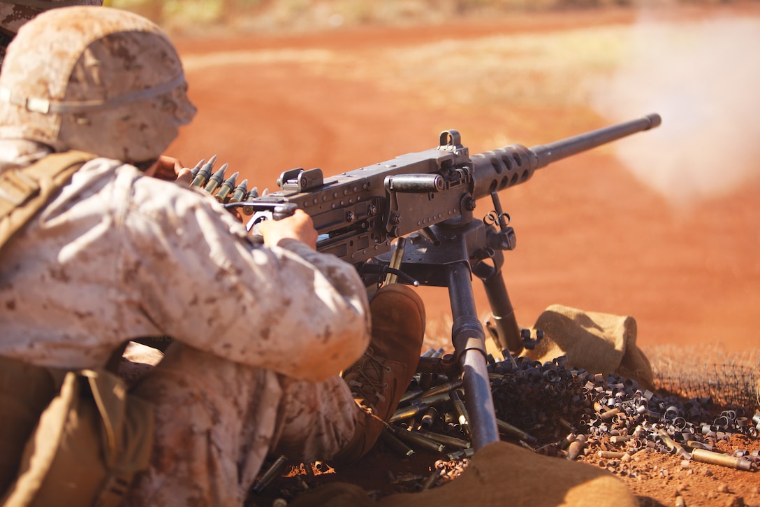 Pfc. Daniel Stillwell, a machine gunner with Charlie Company, 1st Battalion, 3rd Marine Regiment, shoots the .50 caliber M2 Browning machine gun during crew-served weapons training at Schofield Barracks, Oct. 8 through 10, 2013. (U.S. Marine Corps photo by Lance Cpl. Suzanna Knotts)