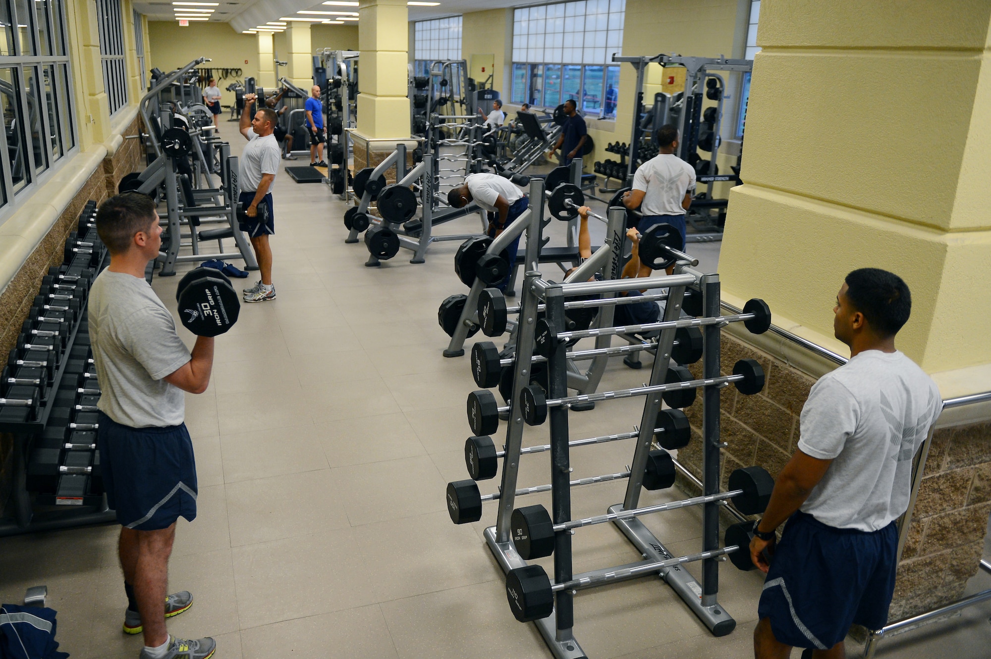 Airmen work out in the Senior Airman Bryan R. Bell Fitness Center on Barksdale Air Force Base, La., Oct. 11, 2013. The Fitness Center recently underwent renovations to add a larger weight room to the facility.  The next phase of the renovation is for a new aerobic room which is projected to take two weeks. (U.S. Air Force photo/Senior Airman Micaiah Anthony)
