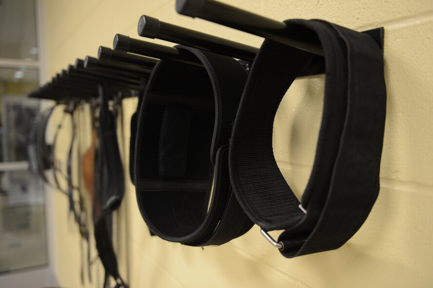 Weight-lifting belts hang on racks at the Senior Airman Bryan R. Bell Fitness Center on Barksdale Air Force Base, La., Oct. 11, 2013. The Fitness Center recently received renovations to add a larger weight room to the facility. (U.S. Air Force photo/Senior Airman Micaiah Anthony)