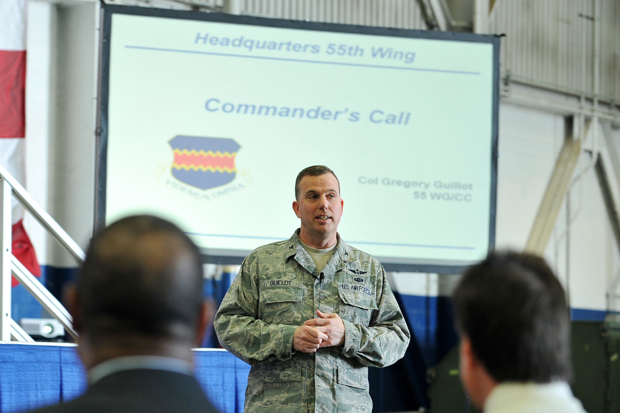 Col. Gregory Guillot, 55th Wing commander, talks to members of the Fightin' Fifty Fifth during one of his commanders calls at the Bennie Davis Maintenance Facility on Oct. 11, at Offutt Air Force Base, Neb. Guillot provided news about the wing's accomplishments over the past year as well as provided an update on the challenges in regards to the ongoing emergency government shutdown.(U.S. Air Force photo by Charles Haymond/Released)