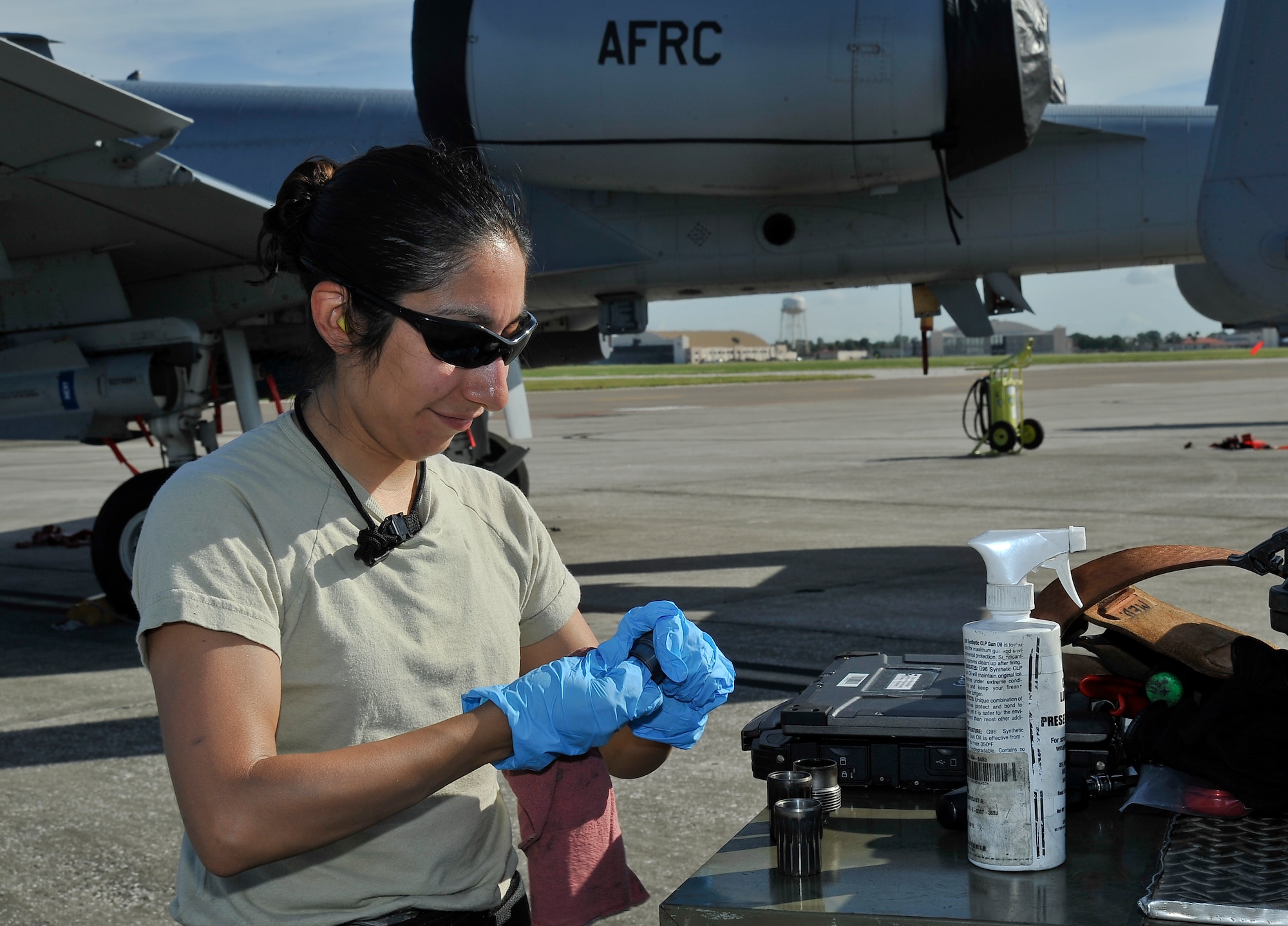 Senior Airman Yolanda Quintero, 442nd Aircraft Maintenance Squadron A-10 armament specialist, cleans pieces of the aircraft Oct. 8, 2013 at MacDill Air Force Base, Fla. Quintero’s job is to ensure the A-10 is fully functioning before a mission. (U.S. Air Force photo by Airman 1st Class Sarah Hall-Kirchner/Released)
