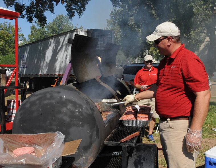 Mr. Trace Colle prepares burgers during Celebrate Barksdale on Barksdale Air Force Base, La., Oct. 11, 2013. The annual event is hosted by the Shreveport-Bossier Military Affairs council to show their appreciation to the men and women of Team Barksdale. (U.S. Air Force photo/Senior Airman Sean Martin)
