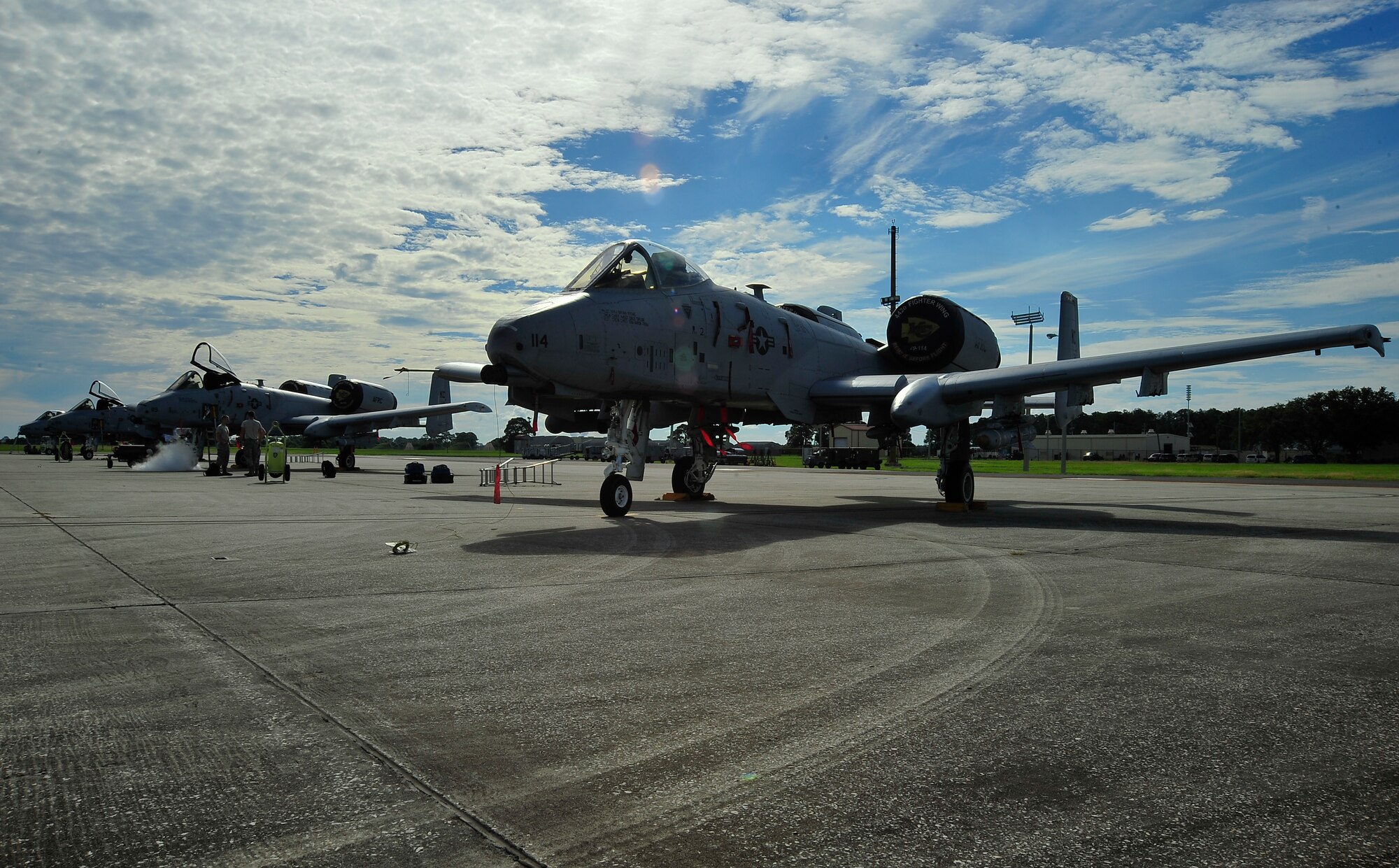 A-10 Thunderbolts from the 442nd Fighter Wing from Whiteman Air Force Base, Mo. are temporarily maintained on the flightline at MacDill Air Force Base, Fla. Oct. 4, 2013. Ten aircraft, their pilots, maintainers and munitions personnel came to MacDill to practice for real-world situations. (U.S. Air Force photo by Airman 1st Class Sarah Hall-Kirchner/Released)