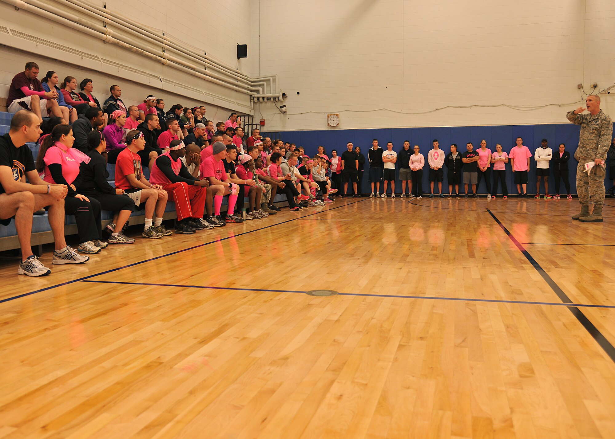 Col. Paul Bauman, 319th Air Base Wing commander, provides opening remarks Oct. 10, 2013, at the Grand Forks Air Force Base, N.D., base fitness center. Bauman thanked all joggers, walkers and runners for participating in the Breast Cancer Awareness 5K hosted by the 319th Medical Group. Participants wore pink in observance of Breast Cancer Awareness Month. (U.S. Air Force photo/Senior Airman Xavier Navarro) 