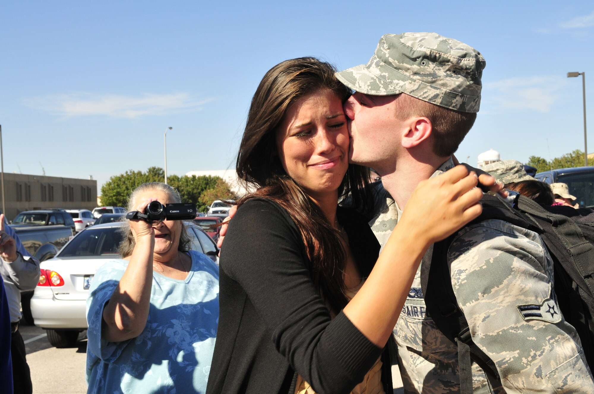 Airman 1st Class Clint Grunalt, who performs hydraulic maintenance on the E-3 “Sentry” Airborne Warning and Control System aircraft for the 552nd Aircraft Maintenance Squadron, kisses his wife, Sarah, soon after returning to Tinker Air Force Base Wednesday from a six-month deployment to Southwest Asia with about 135 other fellow Airmen, primarily from the 963rd Airborne Air Control Squadron. Also attending the homecoming were Airman Grunalt’s parents, John and Dawn Grunalt, and his sister, Ashlynn, who drove all the way from Sterling Heights, Mich., to welcome home their son and brother. Airman Grunalt’s grandmother, Mary Jo, made the trip from Amarillo, Texas, as well. Also on hand were a host of Airman Grunalt’s in-laws from Warr Acres, as well as several friends. (Air Force photo by Darren Heusel)