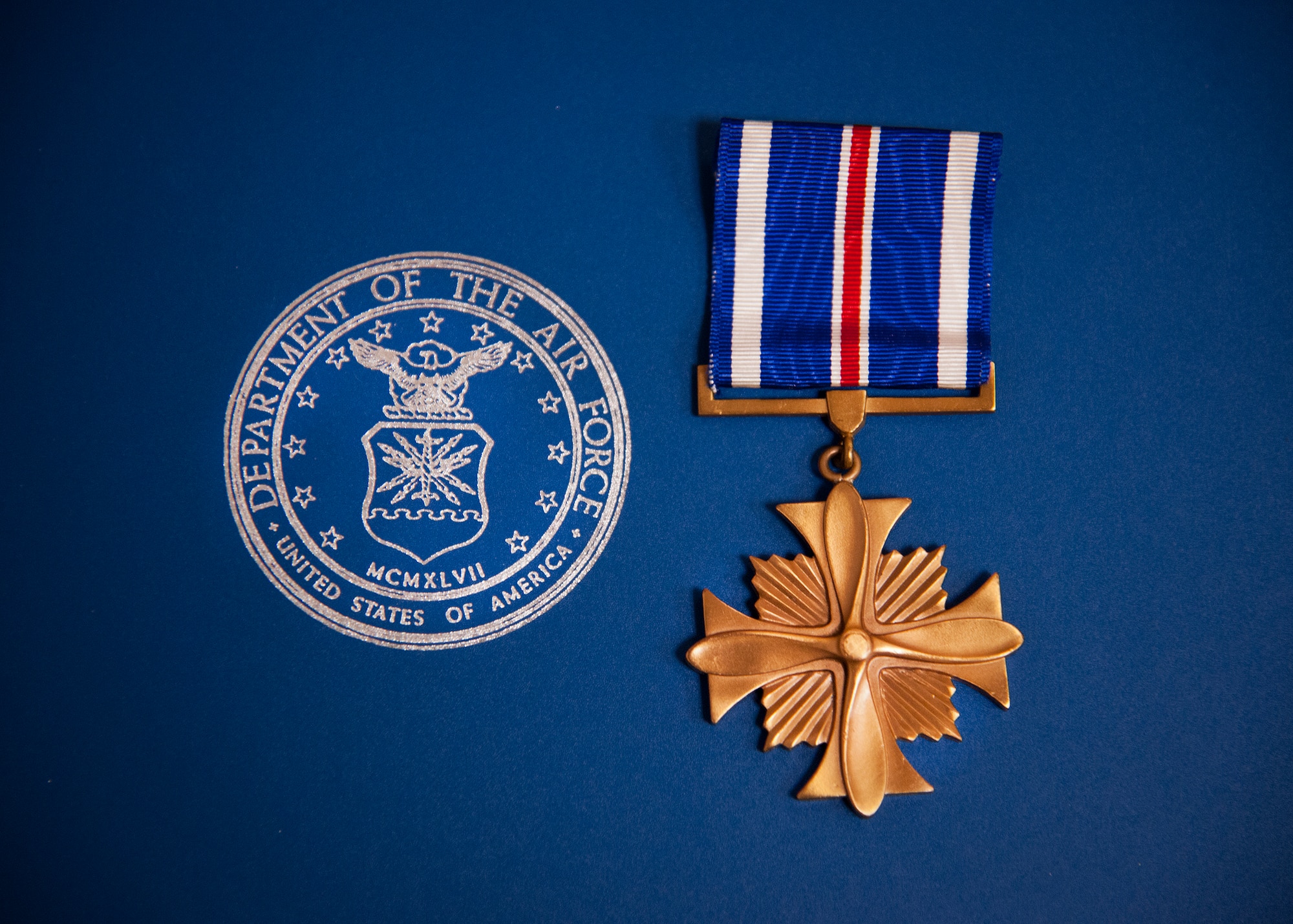 The Distinguished Flying Cross is a military decoration awarded to any officer or enlisted member of the United States Armed Forces who distinguishes himself or herself in support of operations by "heroism or extraordinary achievement while participating in an aerial flight.  Capt. John Easton, of the 86th Fighter Weapons Squadron, received the medal Oct. 11 at Eglin Air Force Base, Fla., for his heroic efforts during an F-15E mission in Libya in 2011.  (U.S. Air Force photo/Samuel King Jr.)