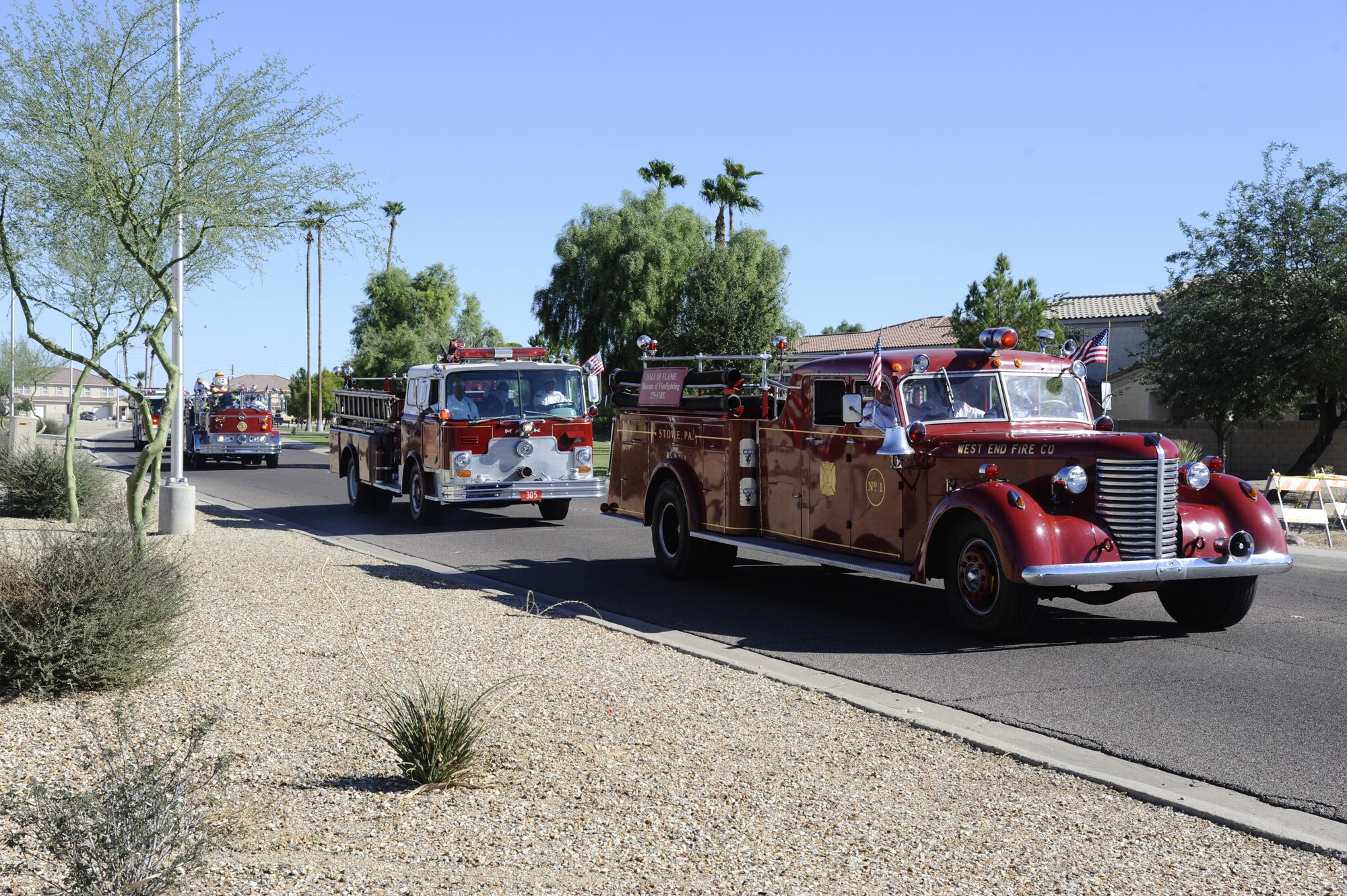 Members of the 56th Civil Engineer Squadron Fire and Emergency Services hold a parade of historic fire trucks through base housing Oct. 5 to launch Fire Prevention Week festivities. (U.S. Air Force photo/Staff Sgt. C.J. Hatch)