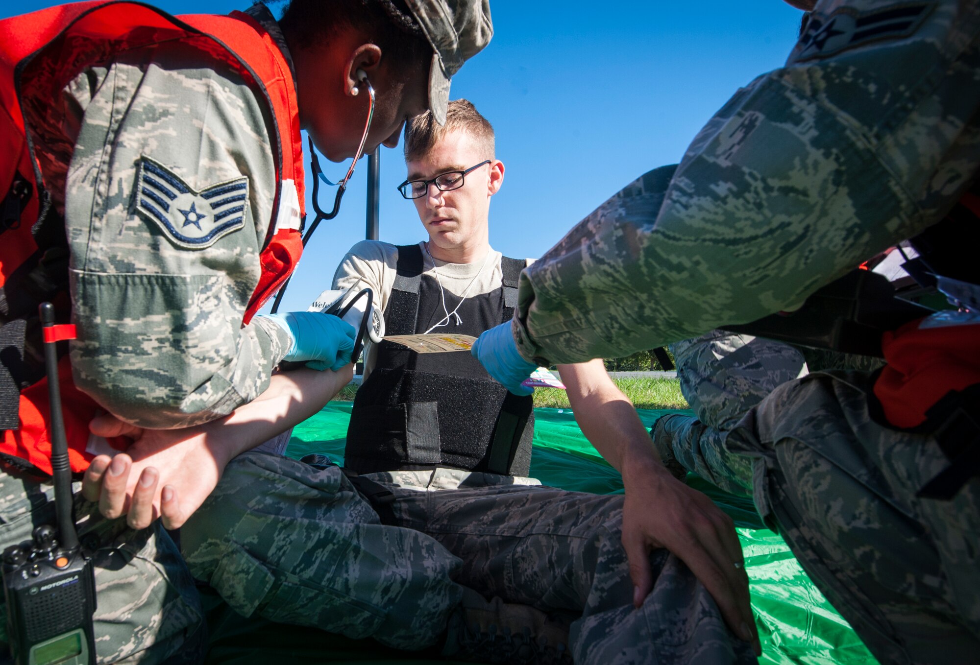 Emergency medical personnel check U.S. Air Force Airman 1st Class Jacob Adams’, 23d Security Forces Squadron, blood pressure during a major accident response exercise at Moody Air Force Base, Ga., Sept. 27, 2013. As part of the exercise scenario, four people were killed and eight wounded from chlorine gas. (U.S. Air Force photo by Senior Airman Jarrod Grammel/Released)
