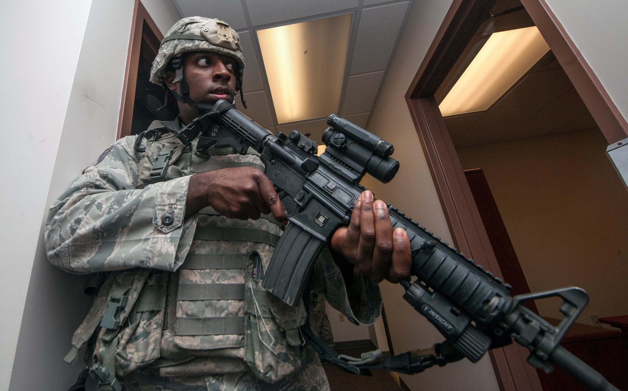 U.S. Air Force Staff Sgt. James Martin, 23d Security Forces Squadron, helps secure the building where a chlorine gas device was set off during a major accident response exercise at Moody Air Force Base, Ga., Sept. 27, 2013. Martin and other security forces members secured the building for medical personnel to collect and treat the severely wounded.  (U.S. Air Force photo by Senior Airman Jarrod Grammel/Released)
