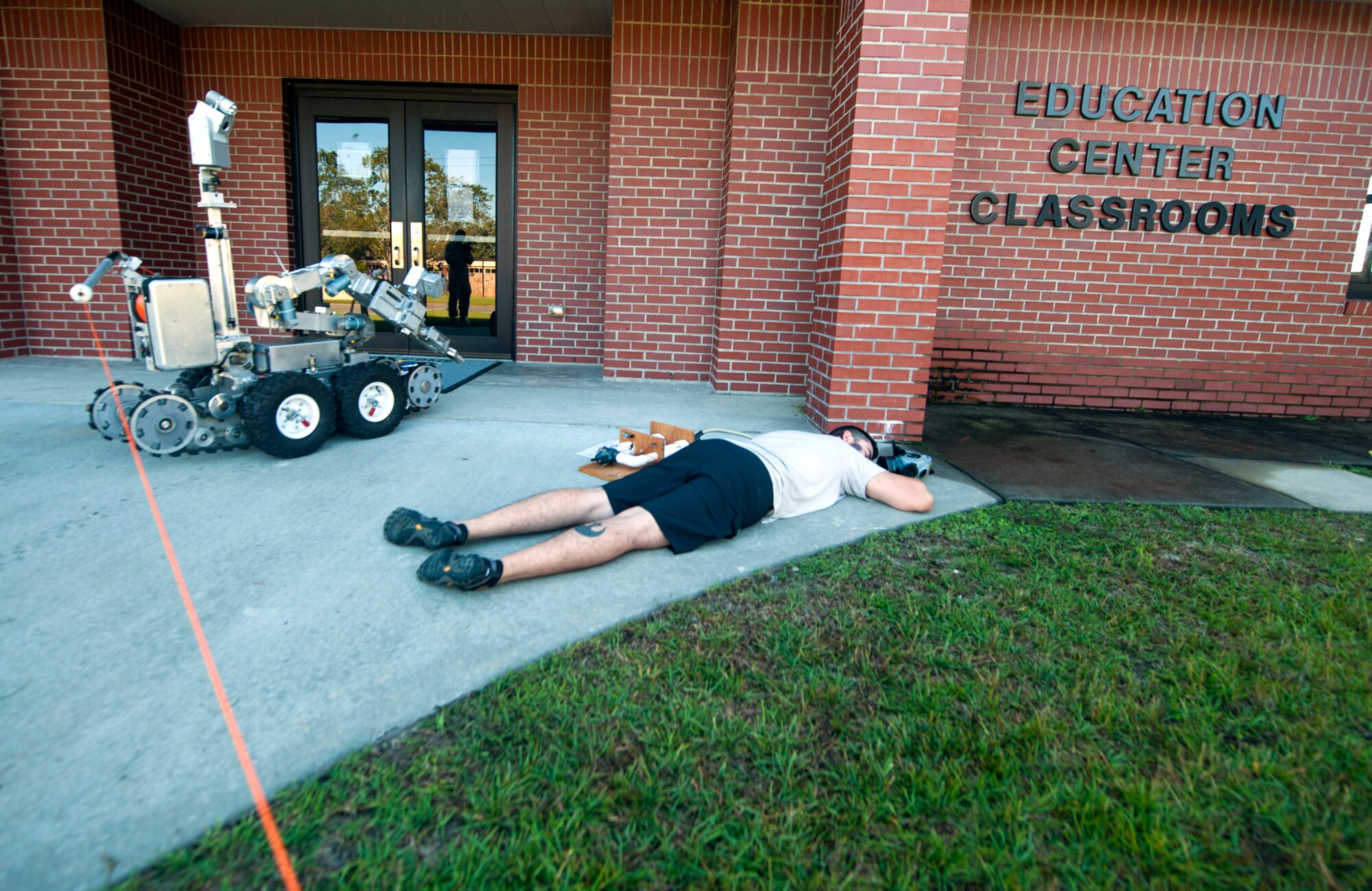 Explosive ordnance disposal Airmen use an F6A Remote Ordnance Neutralization System to investigate the scene during a major accident response exercise at Moody Air Force Base, Ga., Sept. 27, 2013. The F6A has a camera and robotic arm used to identify and transport potentially dangerous devices. (U.S. Air Force photo by Senior Airman Jarrod Grammel/Released)
