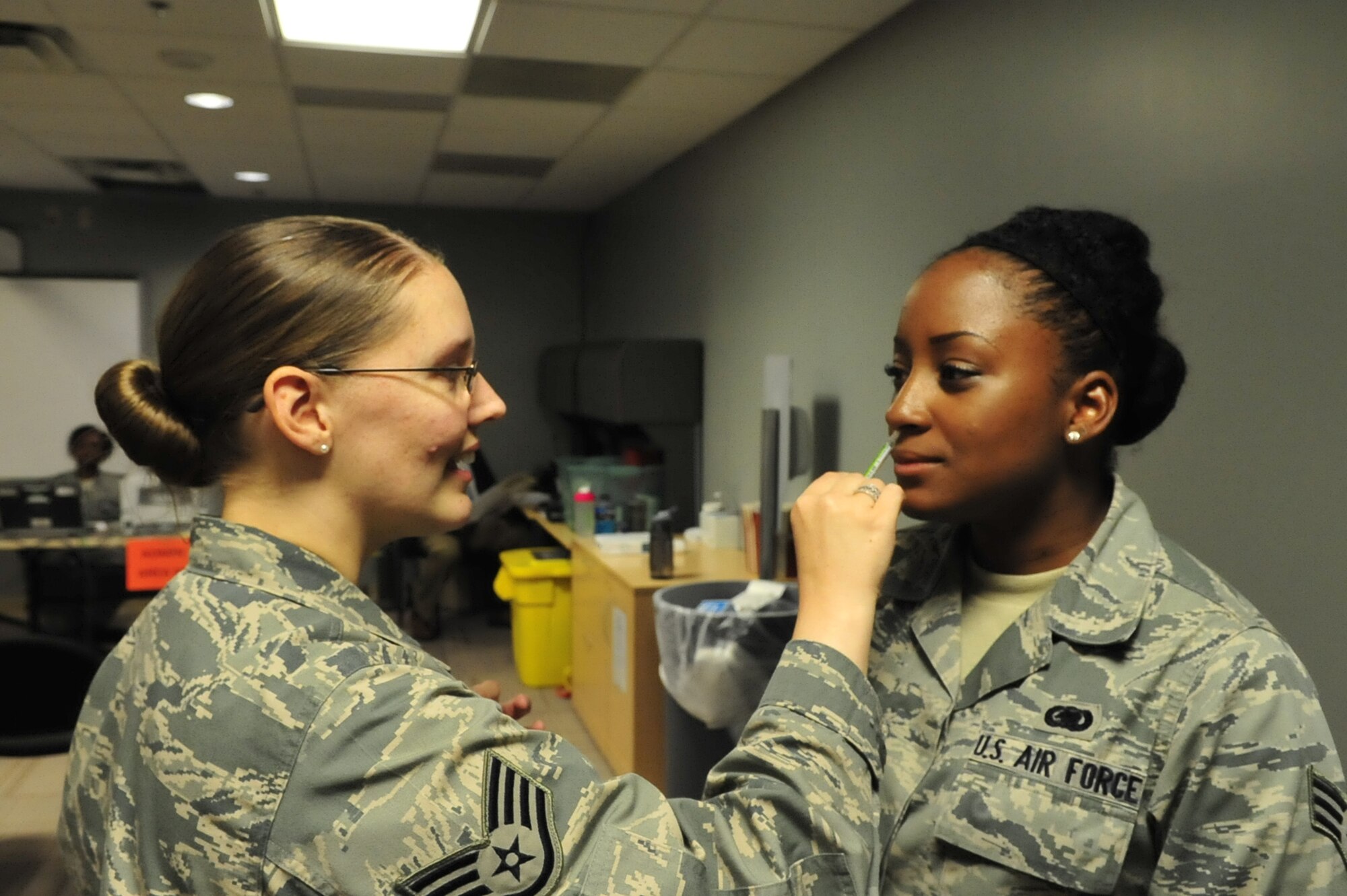 Staff Sgt. Penny Witt, 436th Medical Operations Squadron medical technician, administers the influenza vaccine to Senior Airman Catrina Celestine, 436th Aerial Port Squadron logistics manager, Oct. 10, 2013, at the 436th Medical Group Clinic on Dover Air Force Base, Del. The 436th Medical Group inoculated active duty airman to prepare for the upcoming flu season. (U.S. Air Force photo/Airman 1st Class William Johnson)