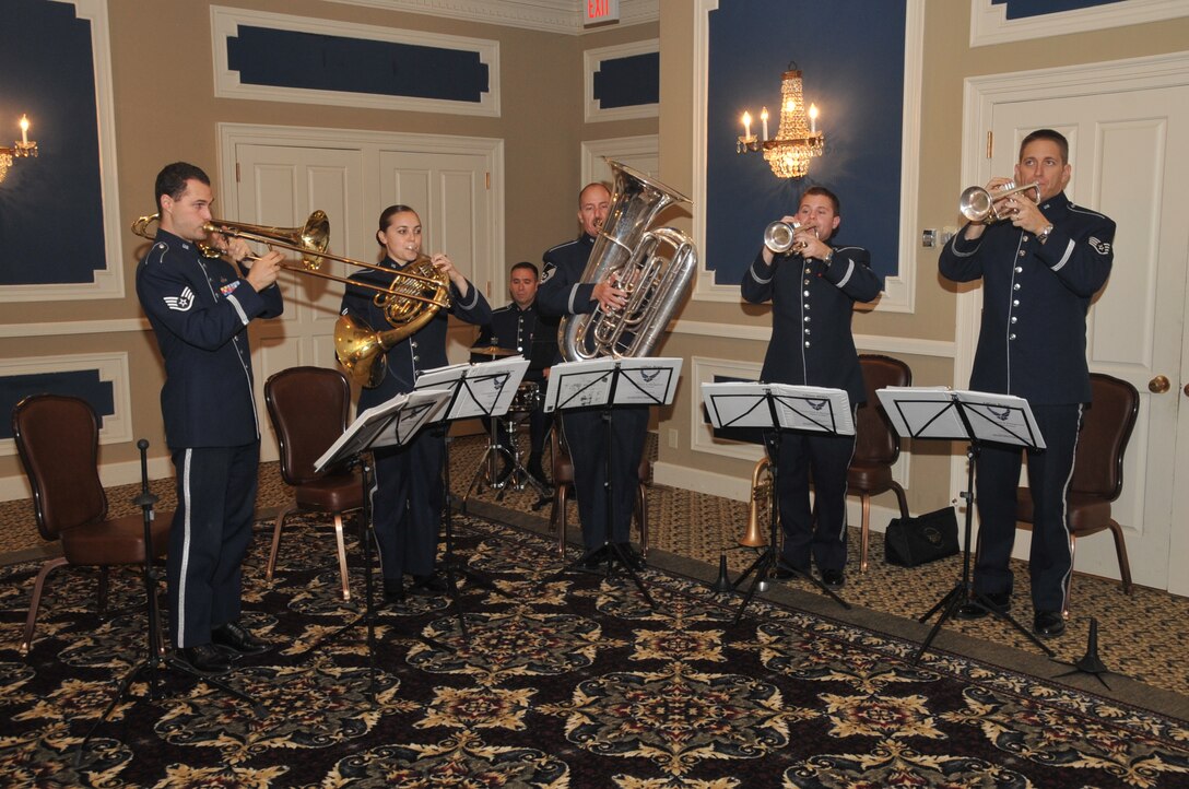 The Heartland of America Band’s Offutt Brass performs at a retirement ceremony at the Patriot Club Oct. 9, at Offutt Air Force Base, Neb. The Offutt Brass includes five brass players that perform on trumpets, French horn, trombone and tuba as well as an additional musician who plays drum set as well as a variety of other percussion instruments. (U.S. Air Force photo by Steve Cunningham/Released)