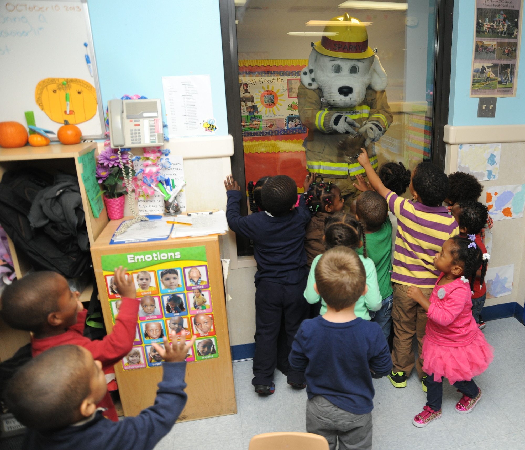Sparky the dog makes an appearance to visit the children at the child development center on Joint Base Andrews, Md., Oct. 10, 2013. The fire safety mascot interacts with the children during National Fire Prevention Week. (U.S. Air Force photo/Airman 1st Class Joshua R. M. Dewberry) 