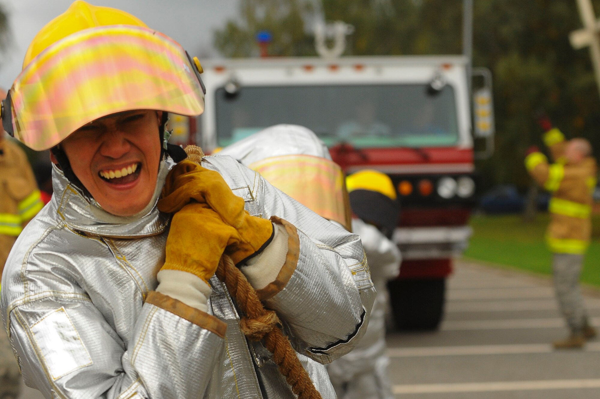 SPANGDAHLEM AIR BASE, Germany--A member of Saber Nation and his team pull a fire truck during the Fire Muster competition Oct. 10, 2013. The fire truck pull was one of the many obstacles teams encountered during the competiton. (U.S. Air Force photo by Senior Airman Rusty/Released)