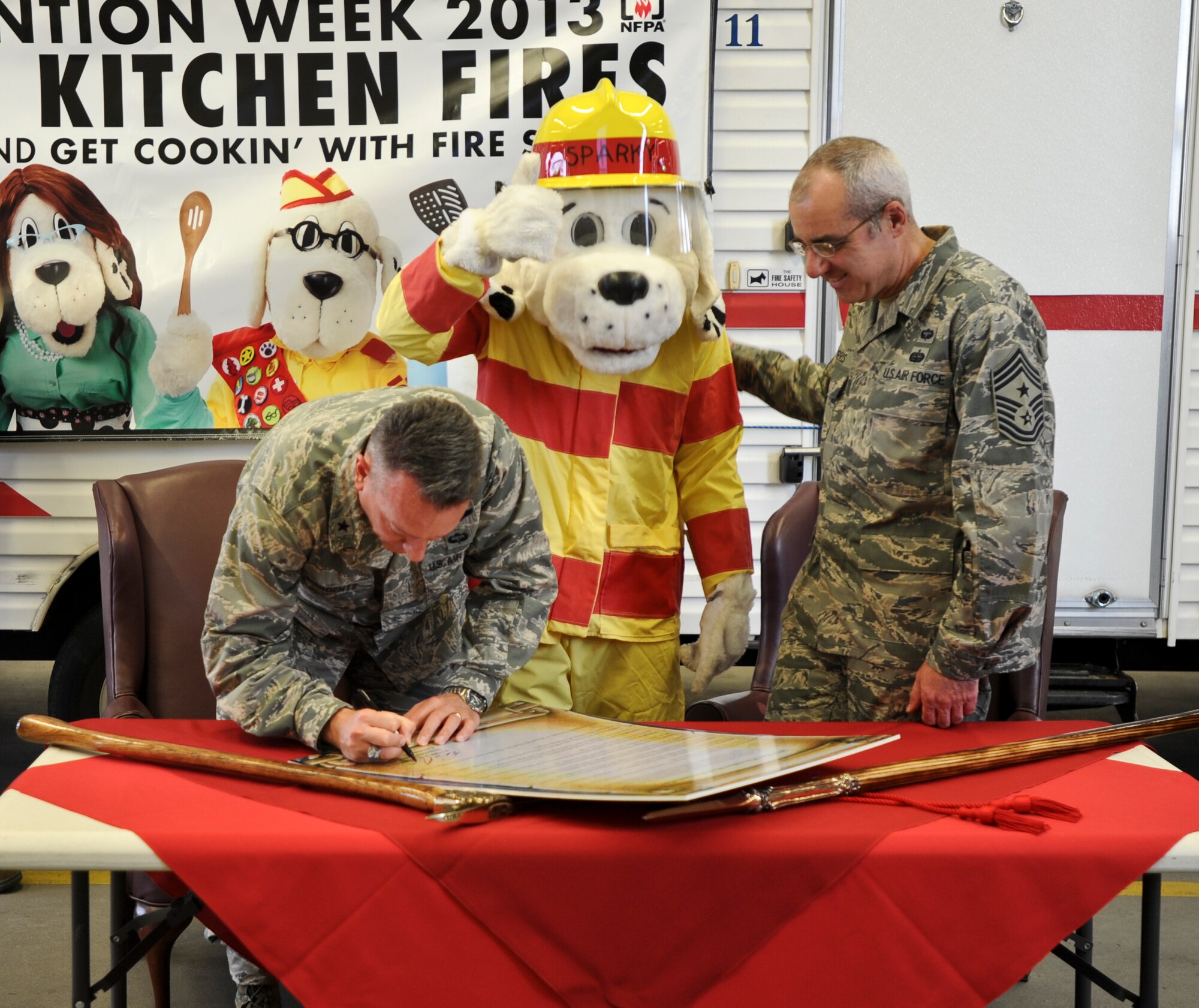 Brig. Gen. Patrick X. Mordente, 86th Airlift Wing commander, signed the 2013 Fire Prevention Week Proclamation, Oct. 4, 2013, Ramstein Air Base, Germany. The purpose of Fire Prevention Week is to stress the importance of reducing the likelihood of kitchen fires.  (U.S. Air Force Photo/Airman 1st Class Michael Stuart)