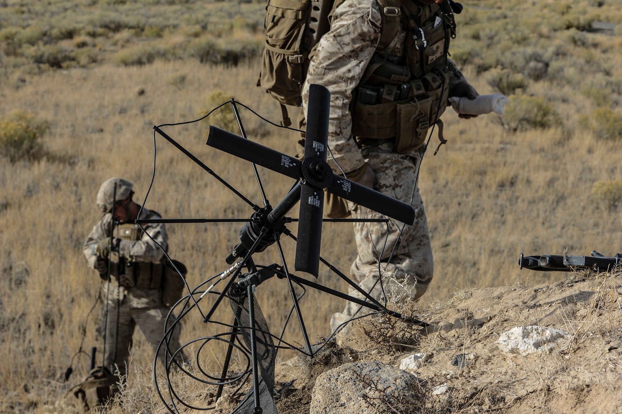U.S. Marines from the 1st Air Naval Gunfire Liaison Company Supporting Arms Liaison Team establish communications prior to an assault on a Juniper Butte Bombing Range mock village near Mountain Home Air Force Base, Idaho, Oct. 9, 2013, during exercise Mountain Roundup. For SALT officers or NCOs leading strikes, command and control is essential, as is communication. (U.S. Air Force photo by Master Sgt. Kevin Wallace/RELEASED)