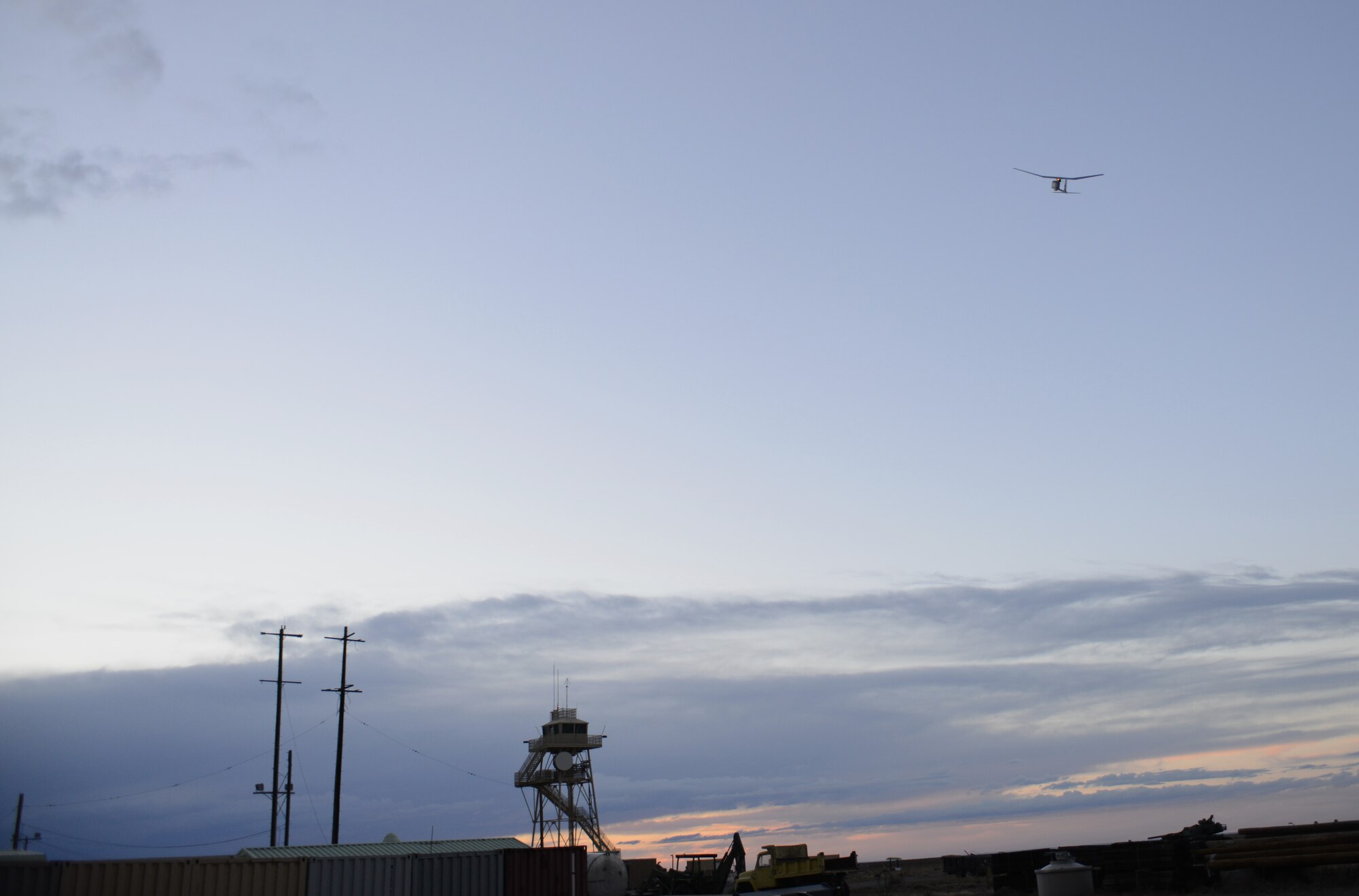 The RQ-11B Raven flies through the Idaho sky Oct. 9, 2013, at the Saylor Creek range. "The Raven is used for taking photos and video of enemy positions,” said Marine Lance Cpl. Nicholas Thompson, 1st ANGLICO forward observer from Clinton, Iowa.  “We can easily fly it into places where the enemy may or may not be, in order to gather strategic reconnaissance information." (U.S. Air Force photo by Senior Airman Benjamin Sutton/RELEASED) 