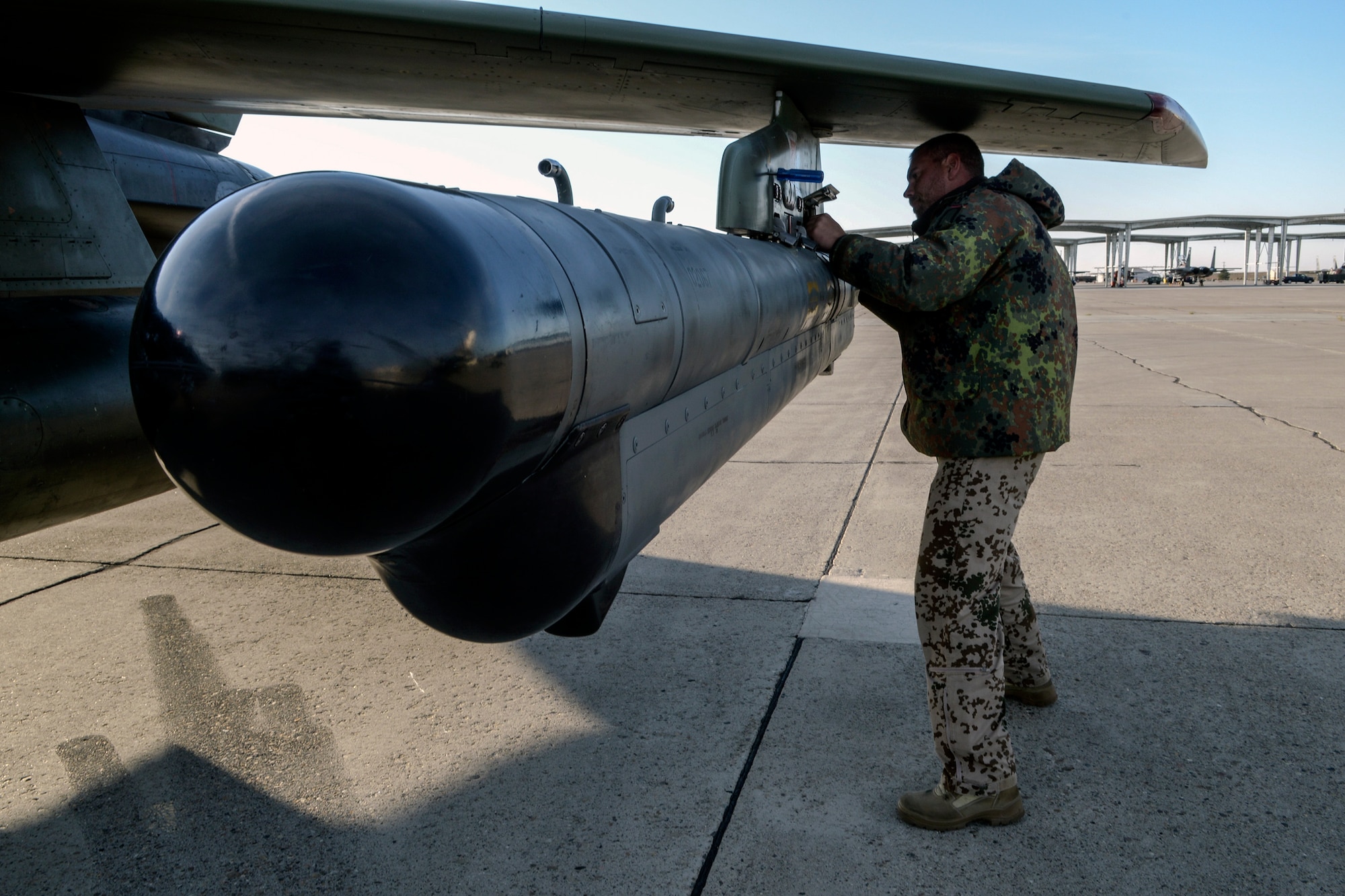 German Air Force crewchiefs and a weapons technician load exercise ordinance on an AG-51 Tornado at Mountain Home Air Force Base, Idaho, Oct. 10, 2013, during exercise Mountain Roundup 2013. Earlier phases of German training are accomplished at Holloman Air Force Base, N.M., where German aviators typically spend three years in continual training, exercising their capability with American partners at annual Mountain Roundups. (U.S. Air Force photo by Master Sgt. Kevin Wallace)