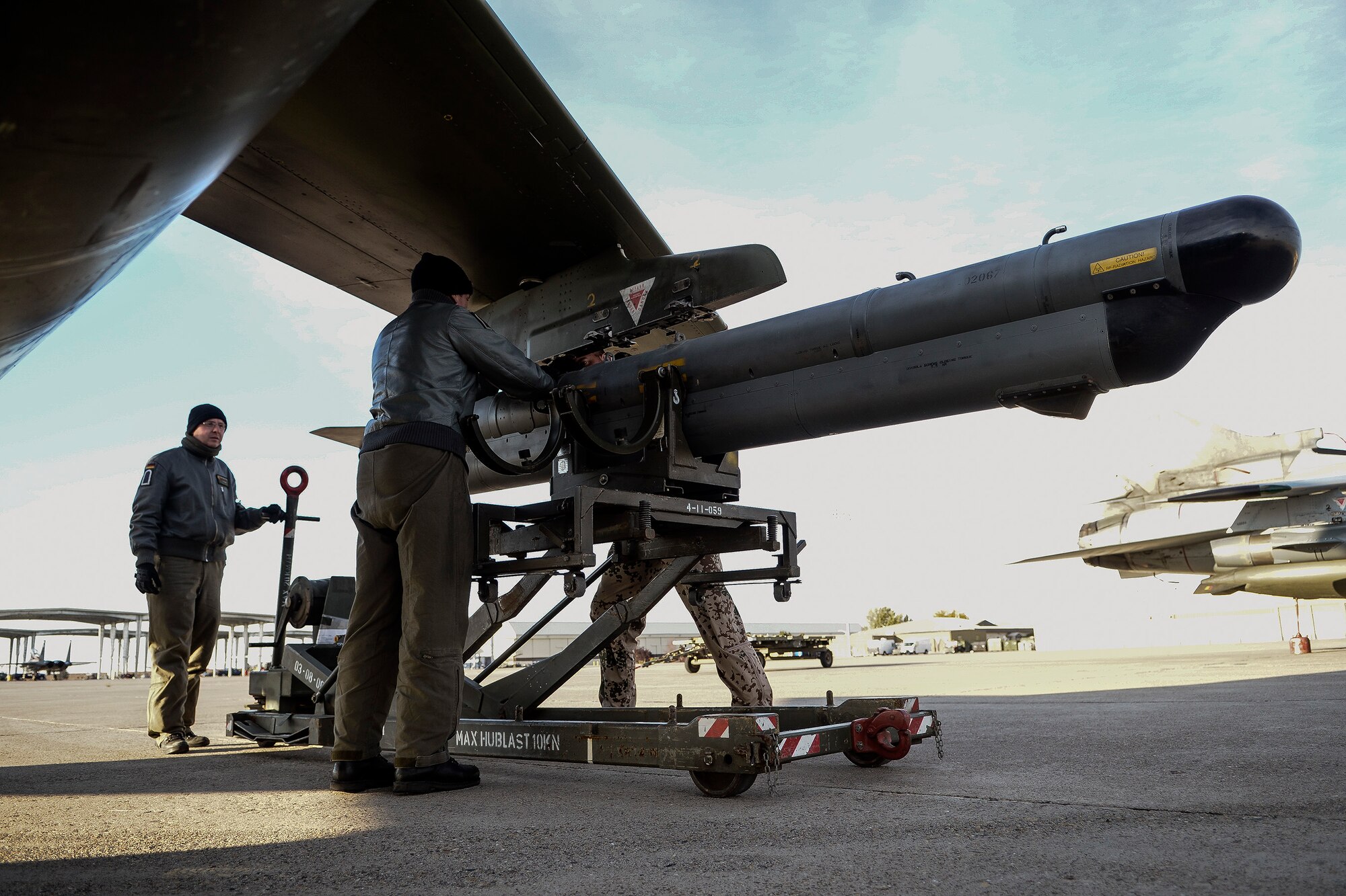 German Air Force crewchiefs and a weapons technician load exercise ordinance on an AG-51 Tornado at Mountain Home Air Force Base, Idaho, Oct. 10, 2013, during exercise Mountain Roundup 2013. German and U.S. Marine Corps joint terminal attack controllers have been working with the GAF for realistic combat and close-air support scenarios. (U.S. Air Force photo by Master Sgt. Kevin Wallace)