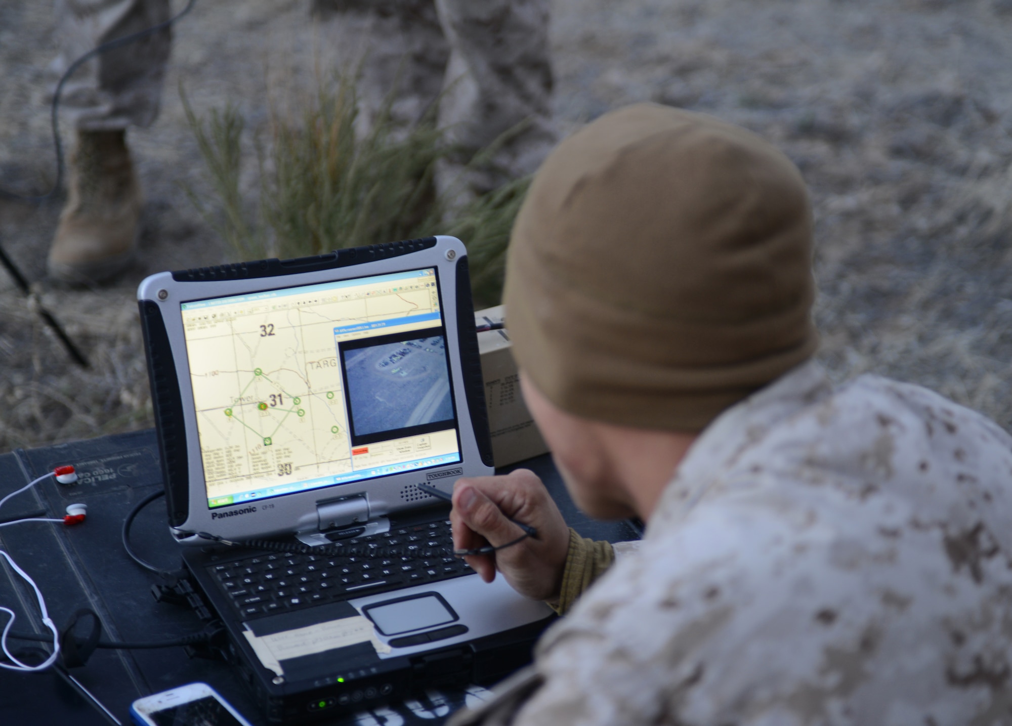 Marine Lance Cpl. William Thornton, 1st ANGLICO forward observer from San Bernardino, Calif., utilizes the remote laptop link of the RQ-11B Raven Oct. 9, 2013, at the Saylor Creek range. During Mountain Roundup, which is part of German Air Force Tornado Fighter Weapons Instructor Course Mission Employment Phase, 1st ANGLICO Marines are utilizing the system in-front of forward fire-teams. (U.S. Air Force photo by Senior Airman Benjamin Sutton/RELEASED) 