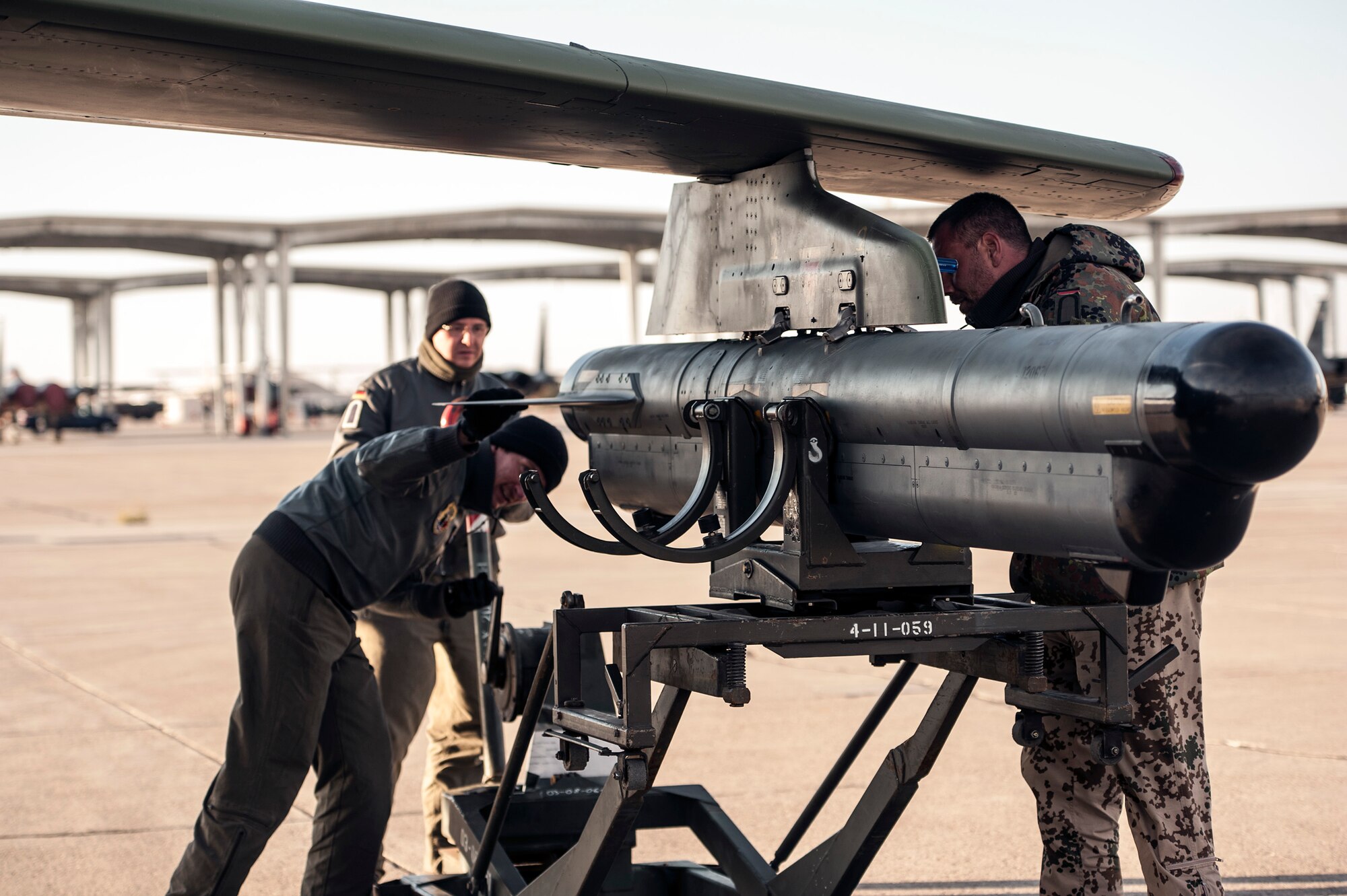 German Air Force crewchiefs and a weapons technician load exercise ordinance on an AG-51 Tornado at Mountain Home Air Force Base, Idaho, Oct. 10, 2013, during exercise Mountain Roundup 2013. German and U.S. Marine Corps joint terminal attack controllers have been working with the GAF for realistic combat and close-air support scenarios. (U.S. Air Force photo by Master Sgt. Kevin Wallace)