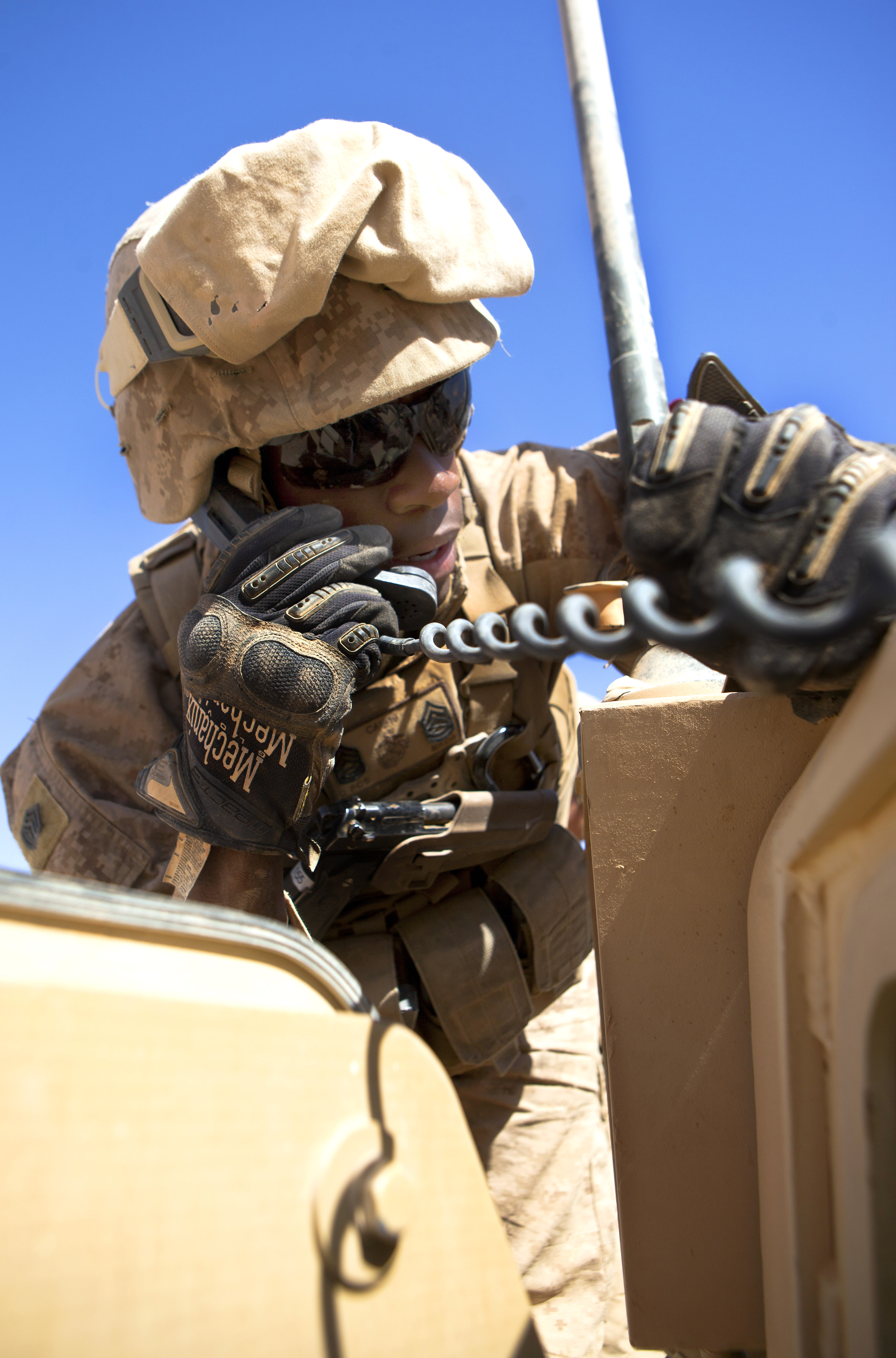 U.S. Marine Corps Gunnery Sgt. Chauncy J. Anderson radios to