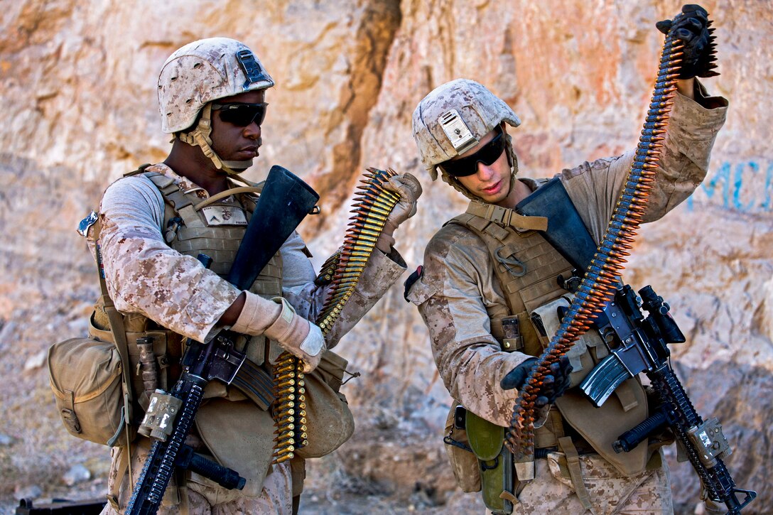 U.S. Marine Corps Lance Cpls. Roosevelt Pierre, left, and Christian ...