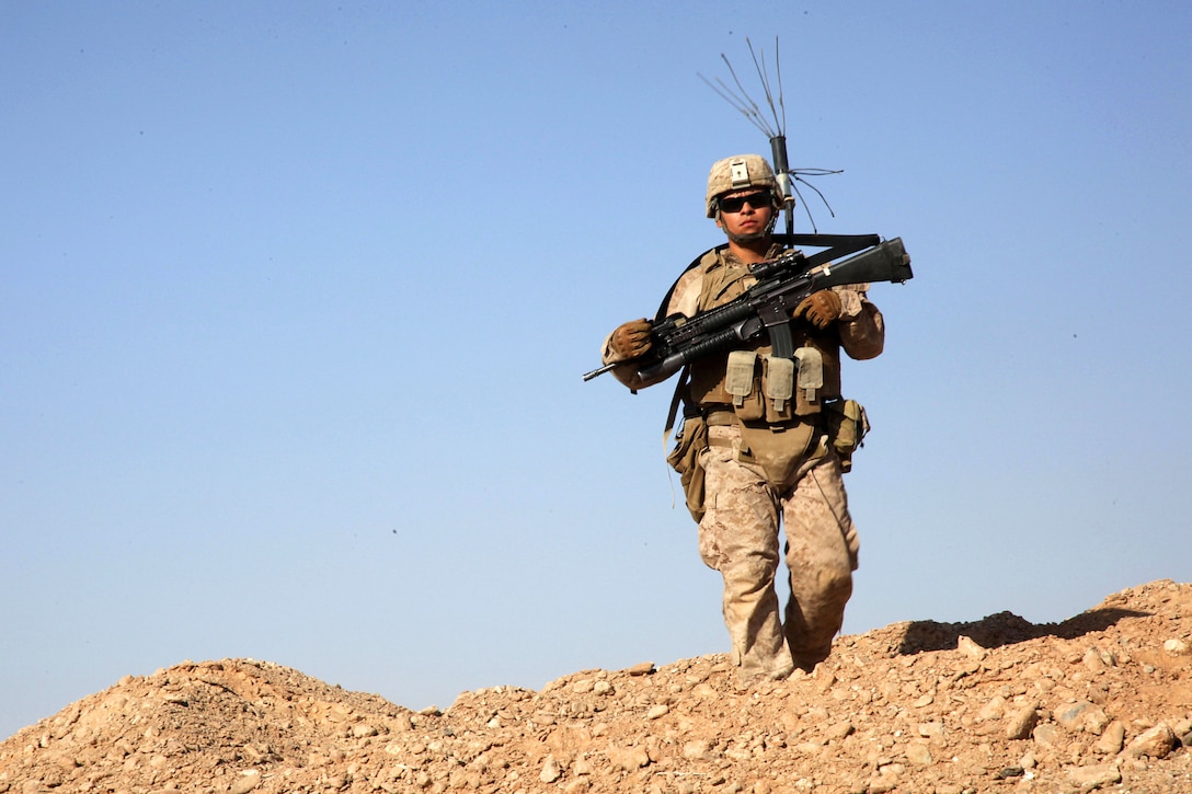 U.S. Marine Corps Cpl. Luis Dominguez patrols in Afghanistan's Helmand province, Oct. 9, 2013. Dominguez, a rifleman, is assigned to India Company, 3rd Battalion, 7th Marine Regiment. The Marines patrolled to deter enemy freedom of movement and improve force protection.