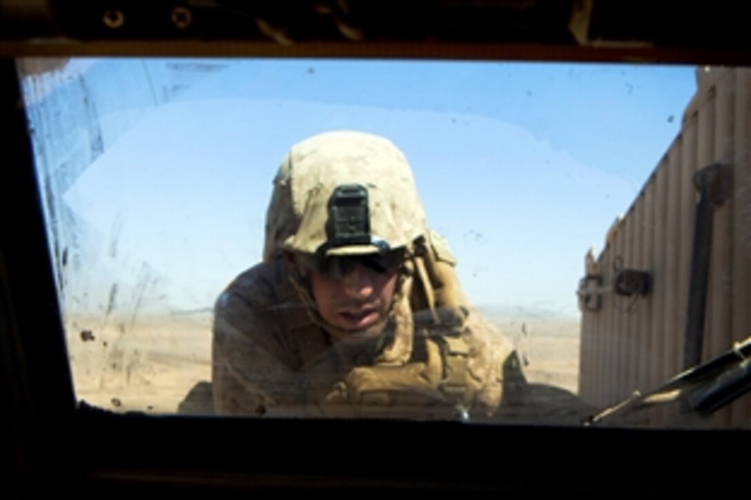 U.S. Marine Corps Lance Cpl. Justin Miller attempts to repair the engine of a mine-resistant, ambush-protected vehicle during a combat logistics patrol in Helmand province, Afghanistan, Oct. 2, 2013. Miller, a vehicle operator, is assigned to Combat Logistics Regiment 2, Regional Command Southwest. 