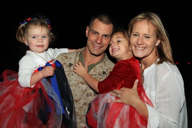 Sgt. Jonathan West, squad leader, L Co., 3rd Battalion, 4th Marines, is reunited with his wife, Jayme, and children Khloe, 2, and Kaylee, 4, during a homecoming at Del Valle Field Oct. 9, 2013.


