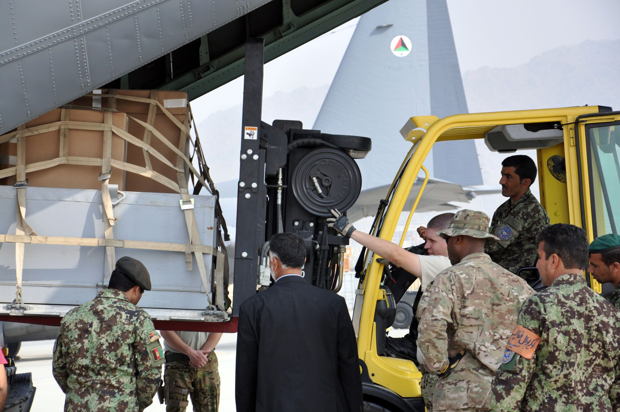Pallets of supplies are loaded on to an Afghan Air Force C-130H as part of the first AAF C-130 mission Oct. 10, 2013 at Kabul International Airport Afghanistan. The first operational mission was flown by both AAF and coalition pilots from NATO Air Training Command-Afghanistan between Kabul International Airport, Afghanistan and Kandahar Airfield, Afghanistan. (U.S. Air Force photo/Capt. Anastasia Wasem)