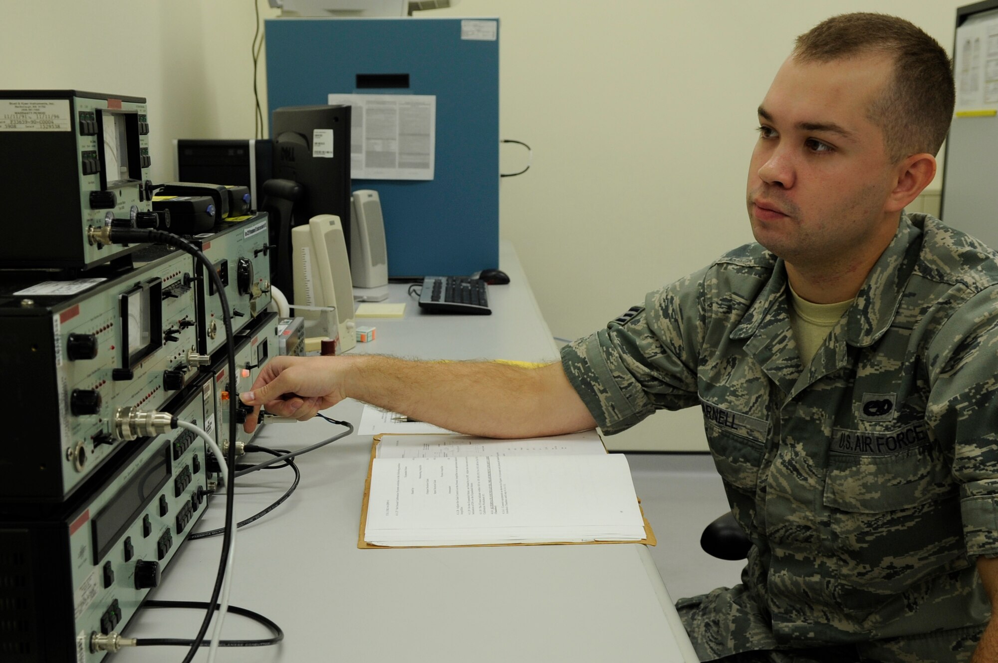 Senior Airman Omar Warnell, 18th Component Maintenance Squadron precision measurement equipment laboratory technician, calibrates medical equipment with noise calibration machines on Kadena Air Base, Japan, Oct. 3, 2013. The technicians on Kadena calibrate the sound equipment for all of the Pacific Air Forces. (U.S. Air Force photo by Senior Airman Marcus Morris)