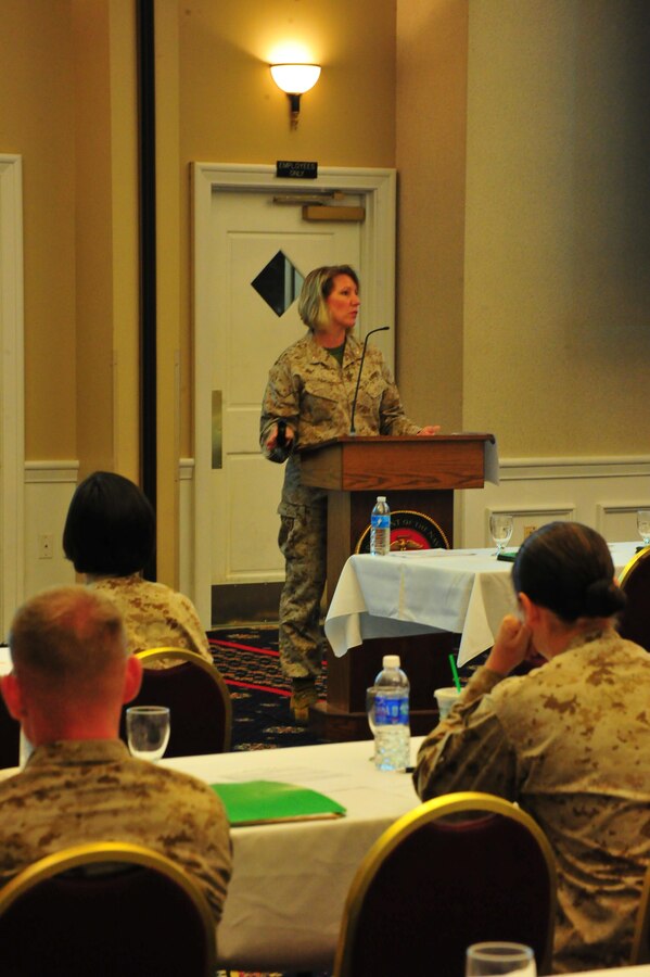 Marines listen as Chief Warrant Officer Dancy Simons, trial services administrative officer, gives a brief on legal policy at The Clubs at Quantico on Oct. 10, 2013. More than two-dozen service members attended the brief as a refresher course for current legal issues.
