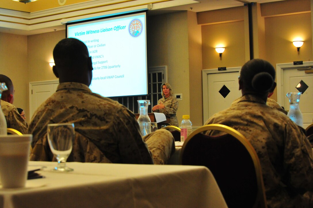 Marines listen as Chief Warrant Officer Dancy Simons, trial services administrative officer, gives a brief on legal policy at The Clubs at Quantico on Oct. 10, 2013. More than two-dozen service members attended the brief as a refresher course for current legal issues.
